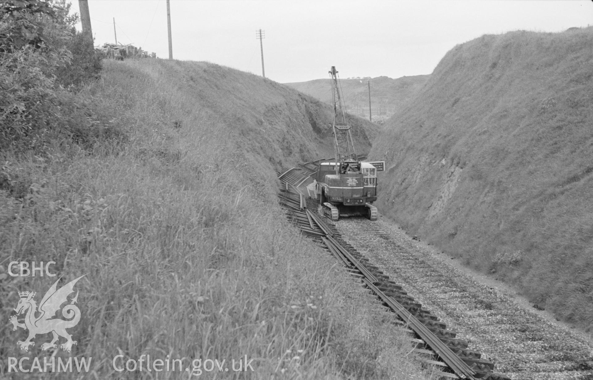 Digital copy of a black and white negative showing the dismantling of the railway at Tanybwlch, near Aberystwyth. Photographed by Arthur O. Chater in June 1966.