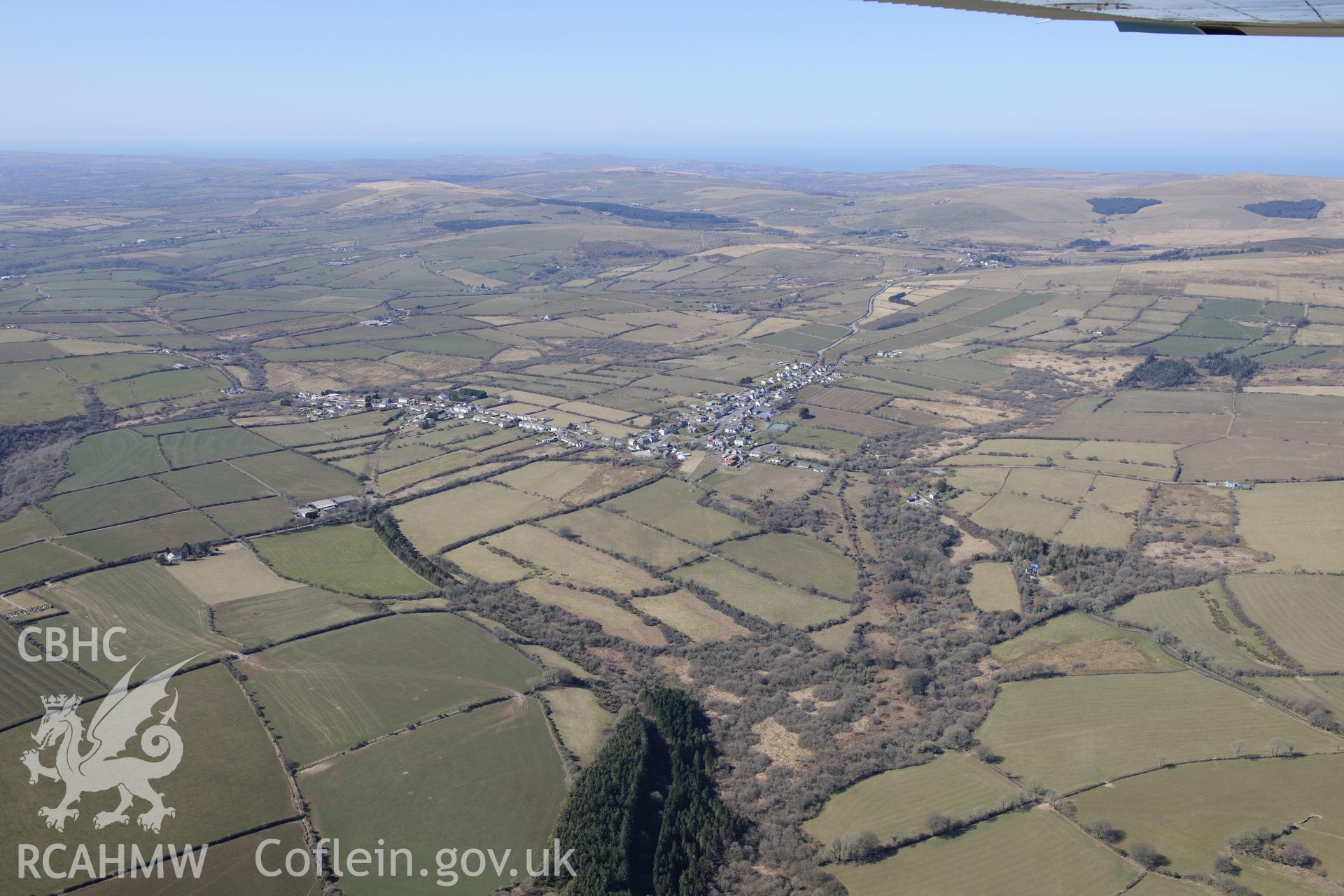 Maenclochog village, south west of Crymych. Oblique aerial photograph taken during the Royal Commission's programme of archaeological aerial reconnaissance by Toby Driver on 2nd April 2013.