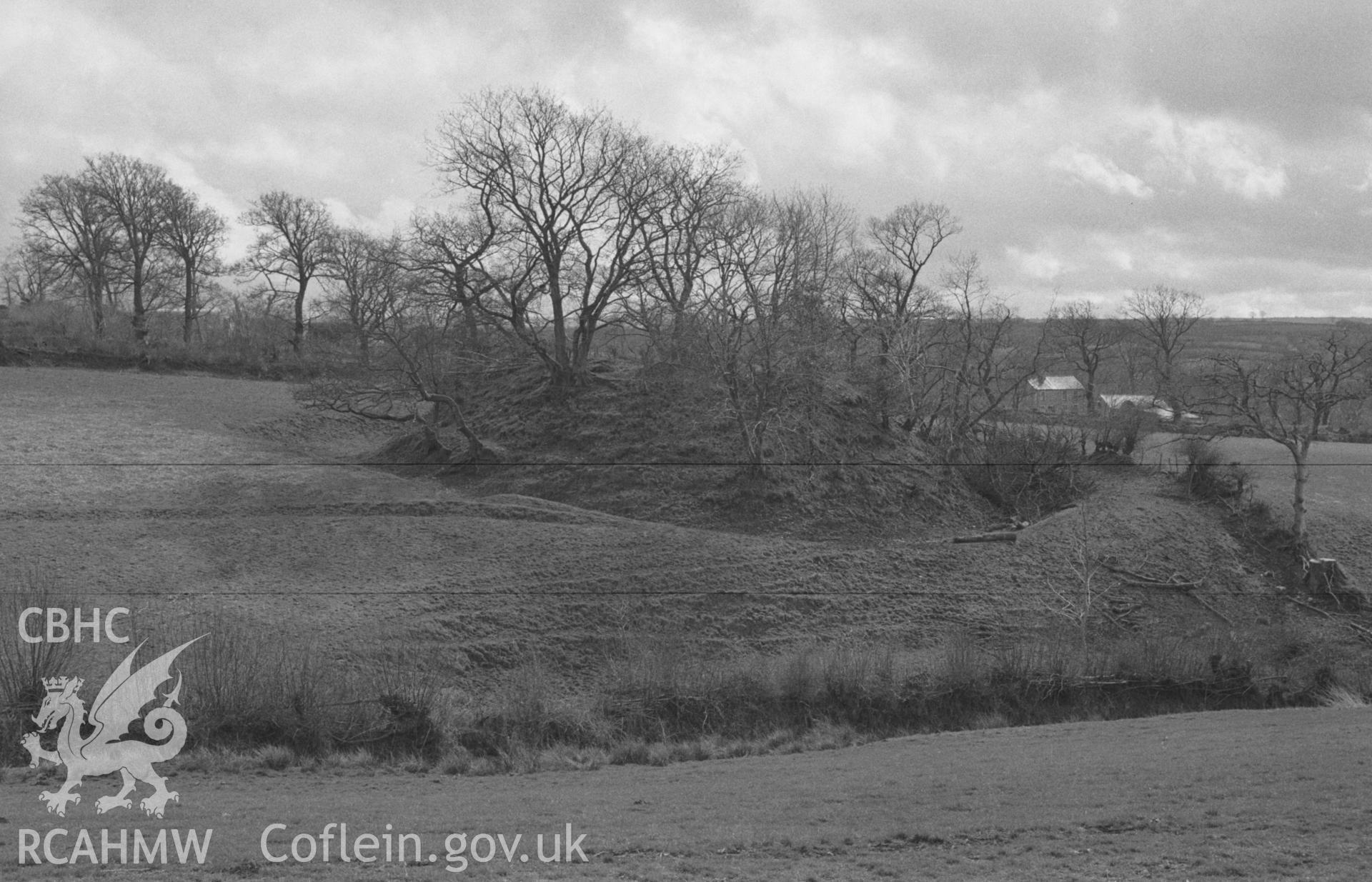 Digital copy of a black and white negative showing Castell Pistog motte, Llandyfriog, Llandysul. Photographed in April 1963 by Arthur O. Chater from Grid Reference SN 3828 4046, looking south south west.