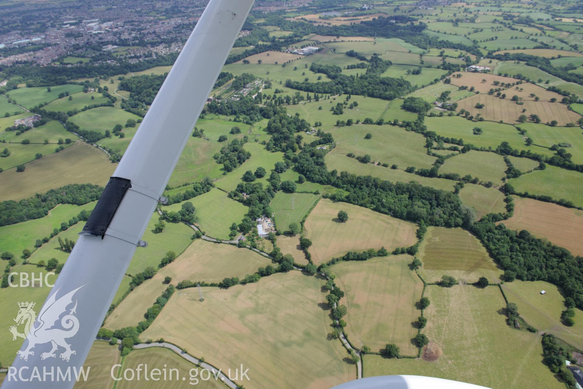 Erddig Hall and section of Wat's Dyke extending through Erddig Park. Oblique aerial photograph taken during the Royal Commission's programme of archaeological aerial reconnaissance by Toby Driver on 30th July 2015.