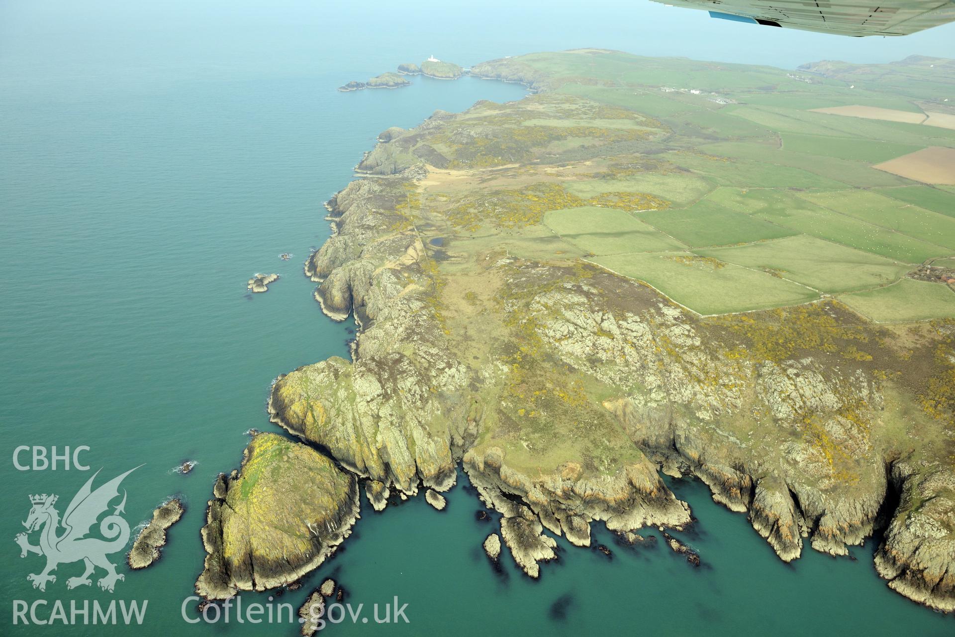 Royal Commission aerial photograph of Strumble Head lighthouse from the south-west taken on 27th March 2017. Baseline aerial reconnaissance survey for the CHERISH Project. ? Crown: CHERISH PROJECT 2017. Produced with EU funds through the Ireland Wales Co-operation Programme 2014-2020. All material made freely available through the Open Government Licence.