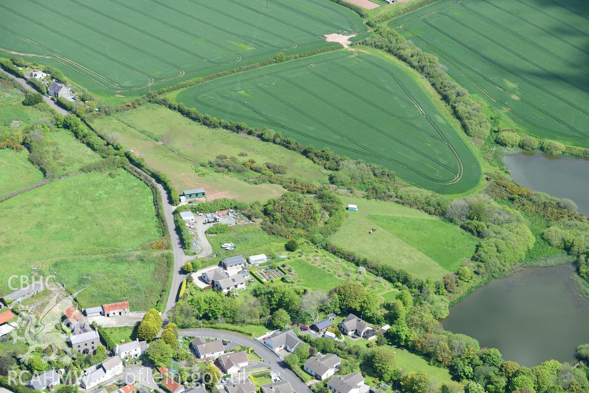 St. Ishmael's Tump. Oblique aerial photograph taken during the Royal Commission's programme of archaeological aerial reconnaissance by Toby Driver on 13th May 2015.