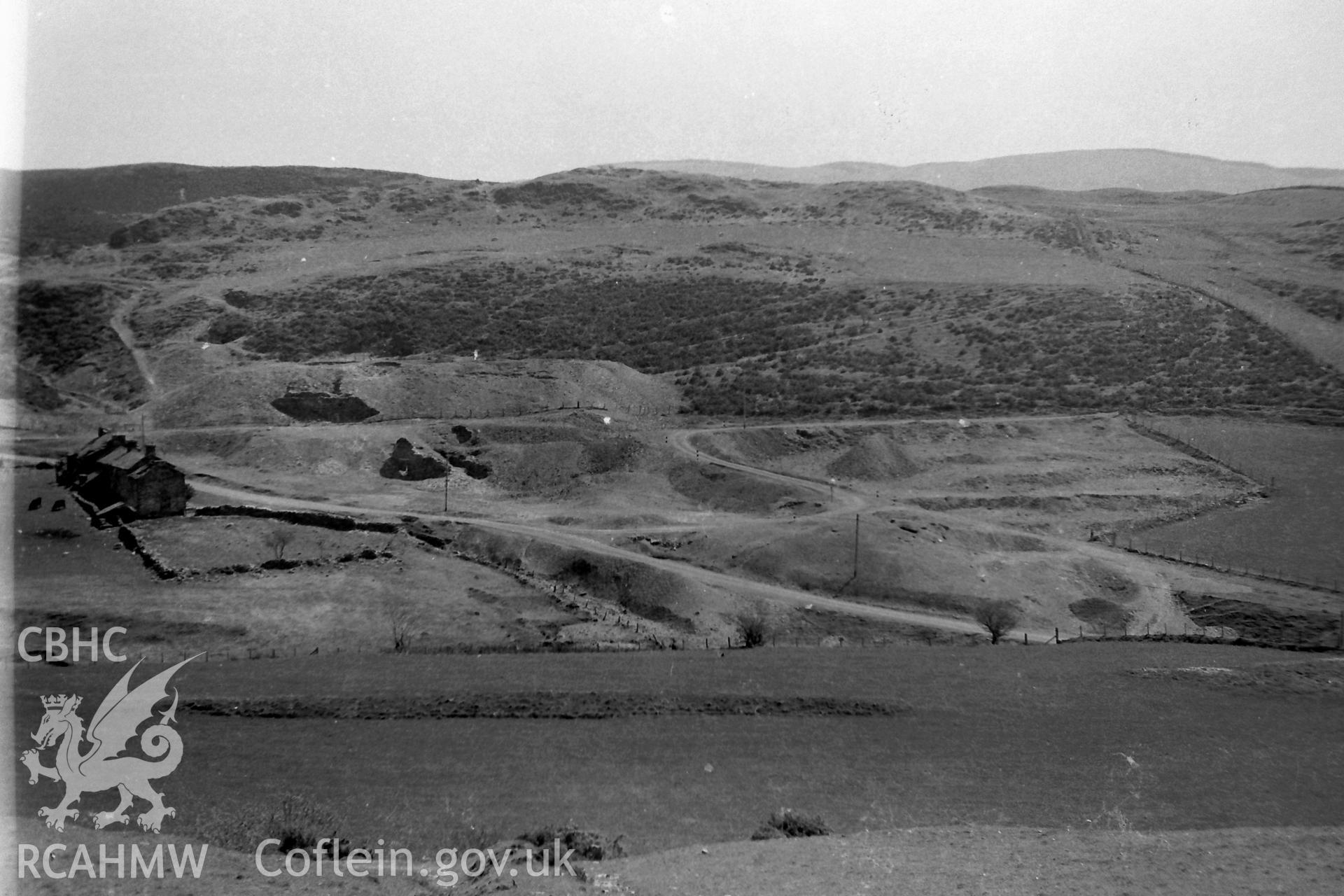 Digitised black & white photograph of Ystumtuen lead mine and dwellings. Produced during a Bachelor of Architecture dissertation entitled: 'The Form and Architecture of Nineteenth Century Industrial Settlements in Rural Wales' by Martin Davies, 1979.