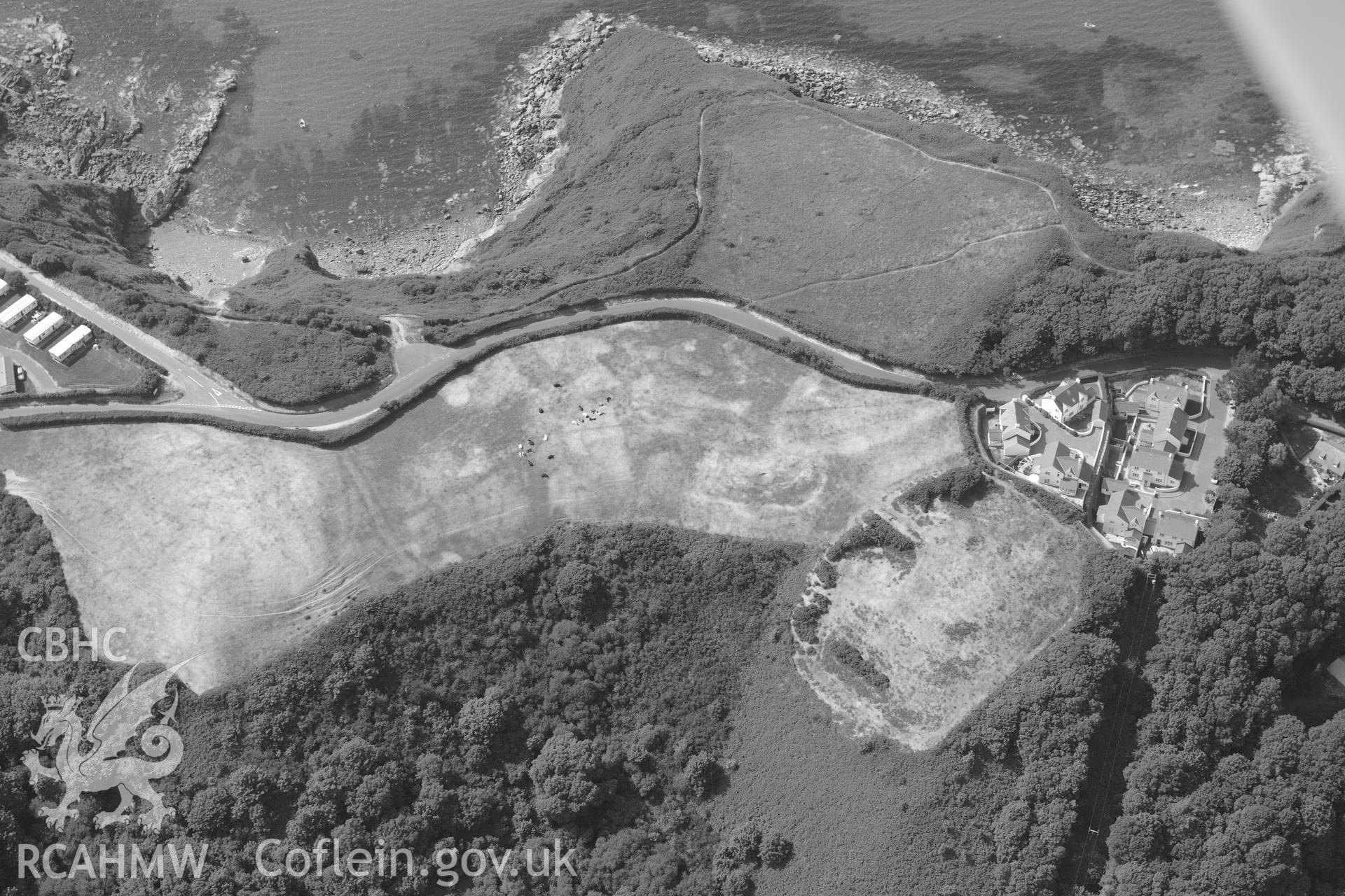 Woodlands defended enclosure, Little Haven. Oblique aerial photograph taken during the Royal Commission?s programme of archaeological aerial reconnaissance by Toby Driver on 16th July 2013.