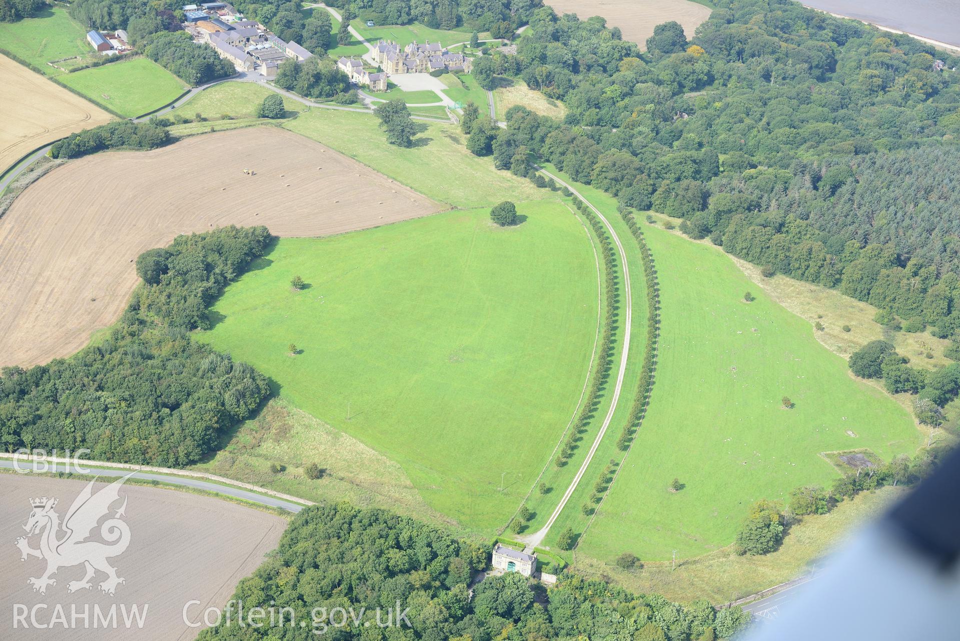 Mostyn Hall - the main block, the stables, the barn and mill and the park and gardens, Mostyn. Oblique aerial photograph taken during the Royal Commission's programme of archaeological aerial reconnaissance by Toby Driver on 11th September 2015.