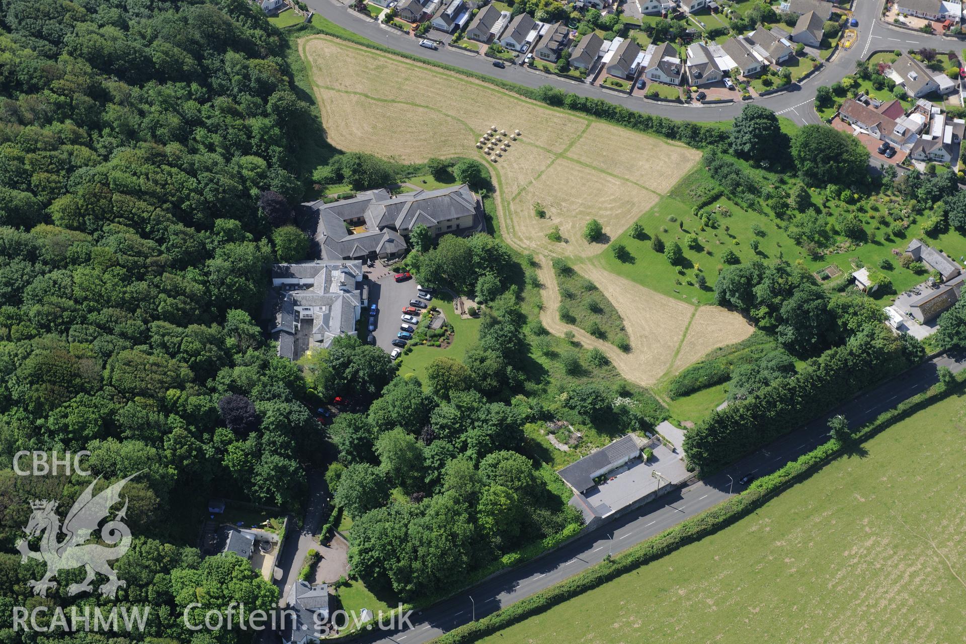 Dan-y-Graig house and garden, and Dan-y-Graig Roman Villa. Oblique aerial photograph taken during the Royal Commission's programme of archaeological aerial reconnaissance by Toby Driver on 19th June 2015.