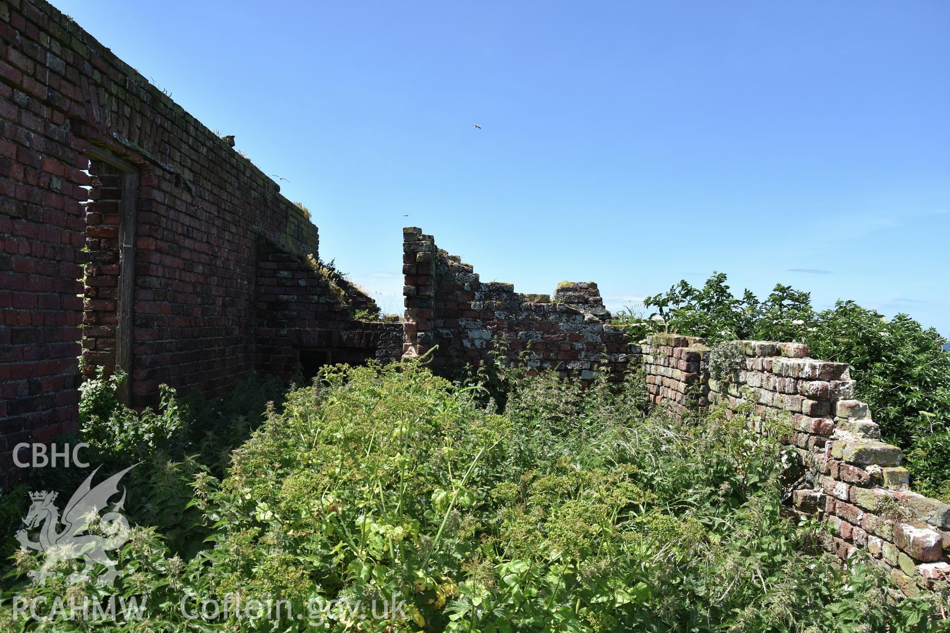 Investigator's photographic survey of the Telegraph Station on Puffin Island or Ynys Seiriol for the CHERISH Project. Interior view of ruin. ? Crown: CHERISH PROJECT 2018. Produced with EU funds through the Ireland Wales Co-operation Programme 2014-2020. All material made freely available through the Open Government Licence.