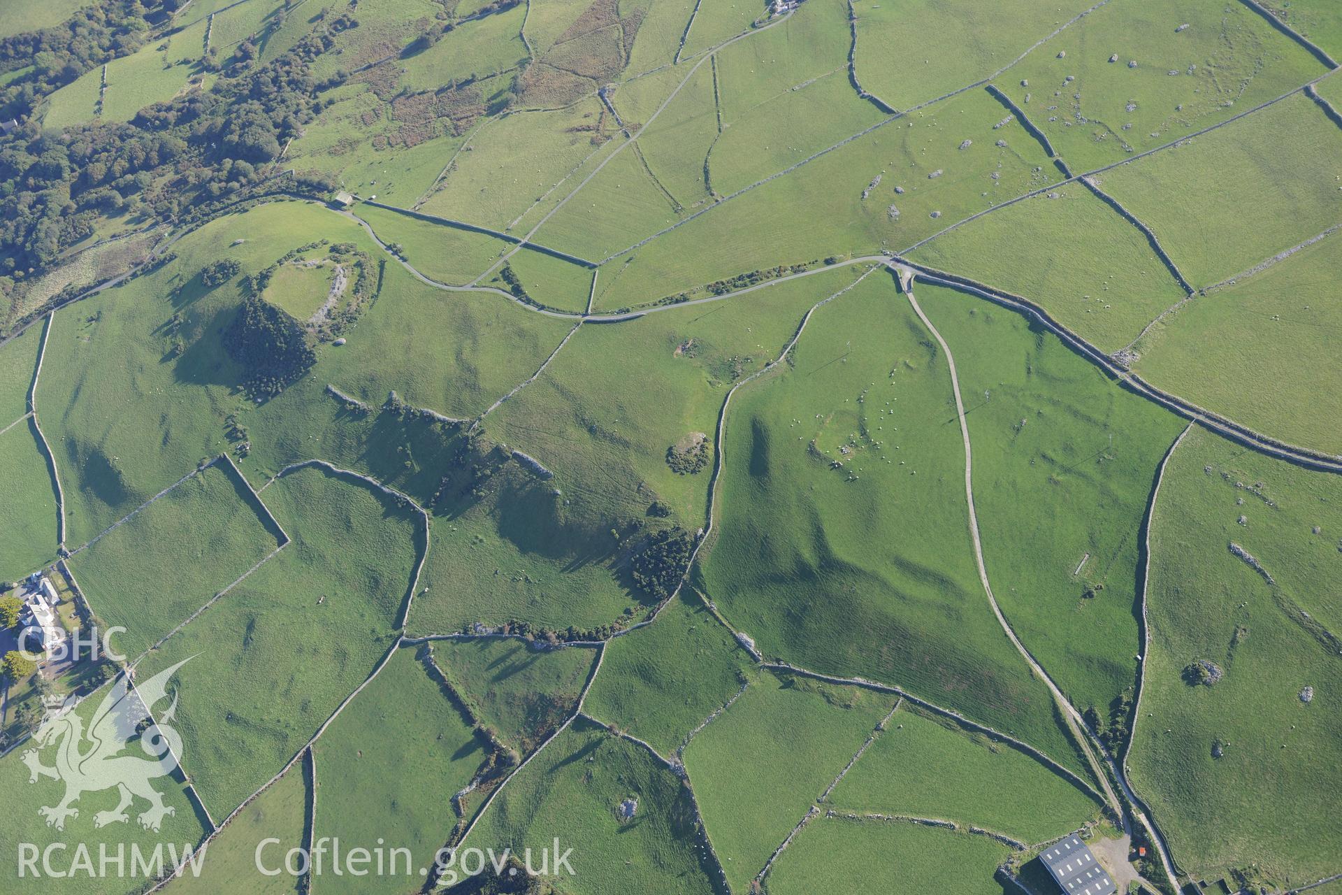 Castell y Gaer, the field system to the west of the Castell, and an enclosure north east of Carn-Gadell Uchaf. Oblique aerial photograph taken during the Royal Commission's programme of archaeological aerial reconnaissance by Toby Driver on 2nd October 2015.