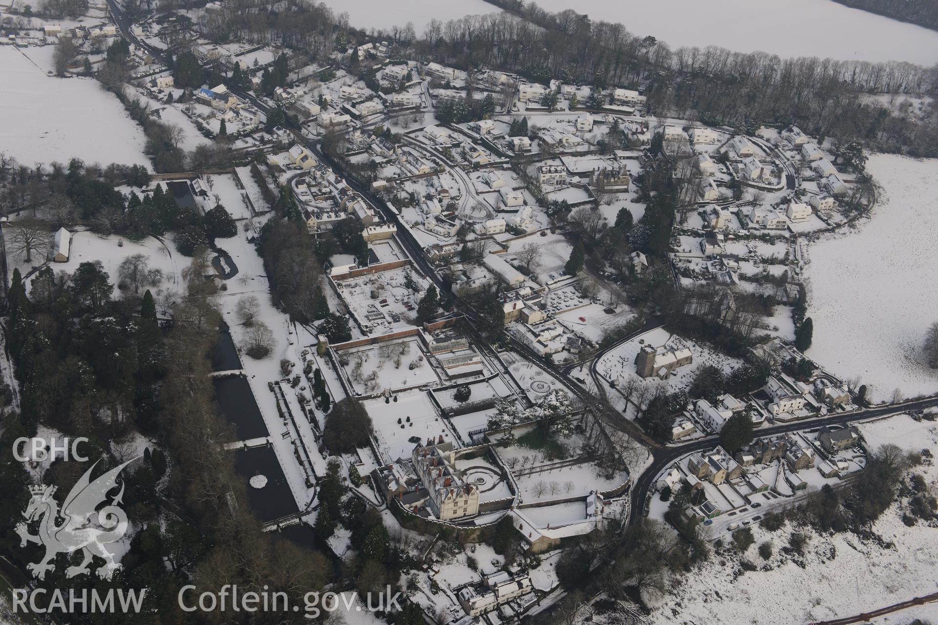 St Fagans Castle and gardens, and St. Mary's Church, at St Fagans Mueseum of Welsh Life. Oblique aerial photograph taken during the Royal Commission?s programme of archaeological aerial reconnaissance by Toby Driver on 24th January 2013.