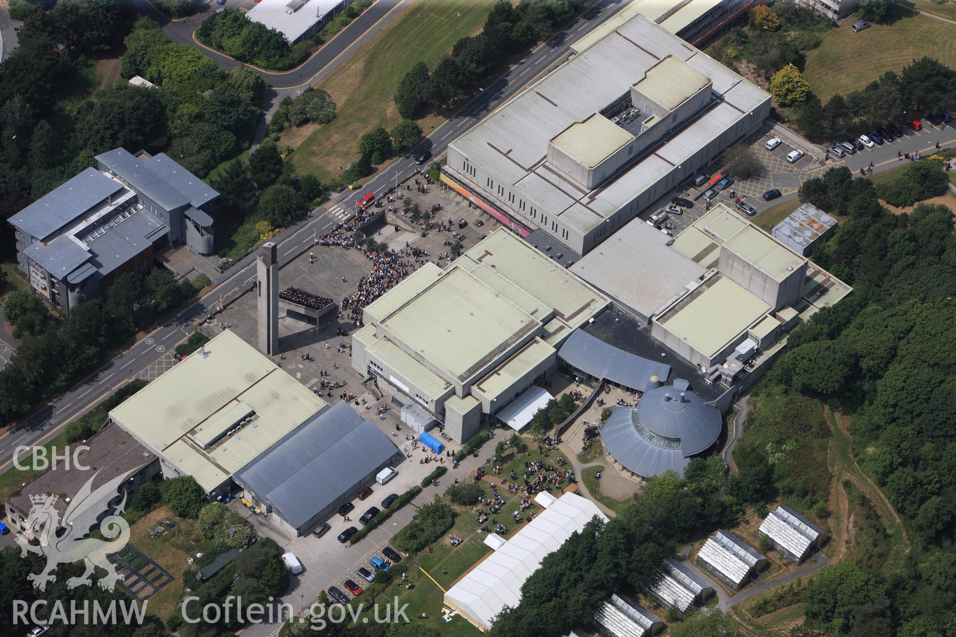 Aberystwyth Arts Centre on Graduation Day. Oblique aerial photograph taken during the Royal Commission?s programme of archaeological aerial reconnaissance by Toby Driver on  12th July 2013.