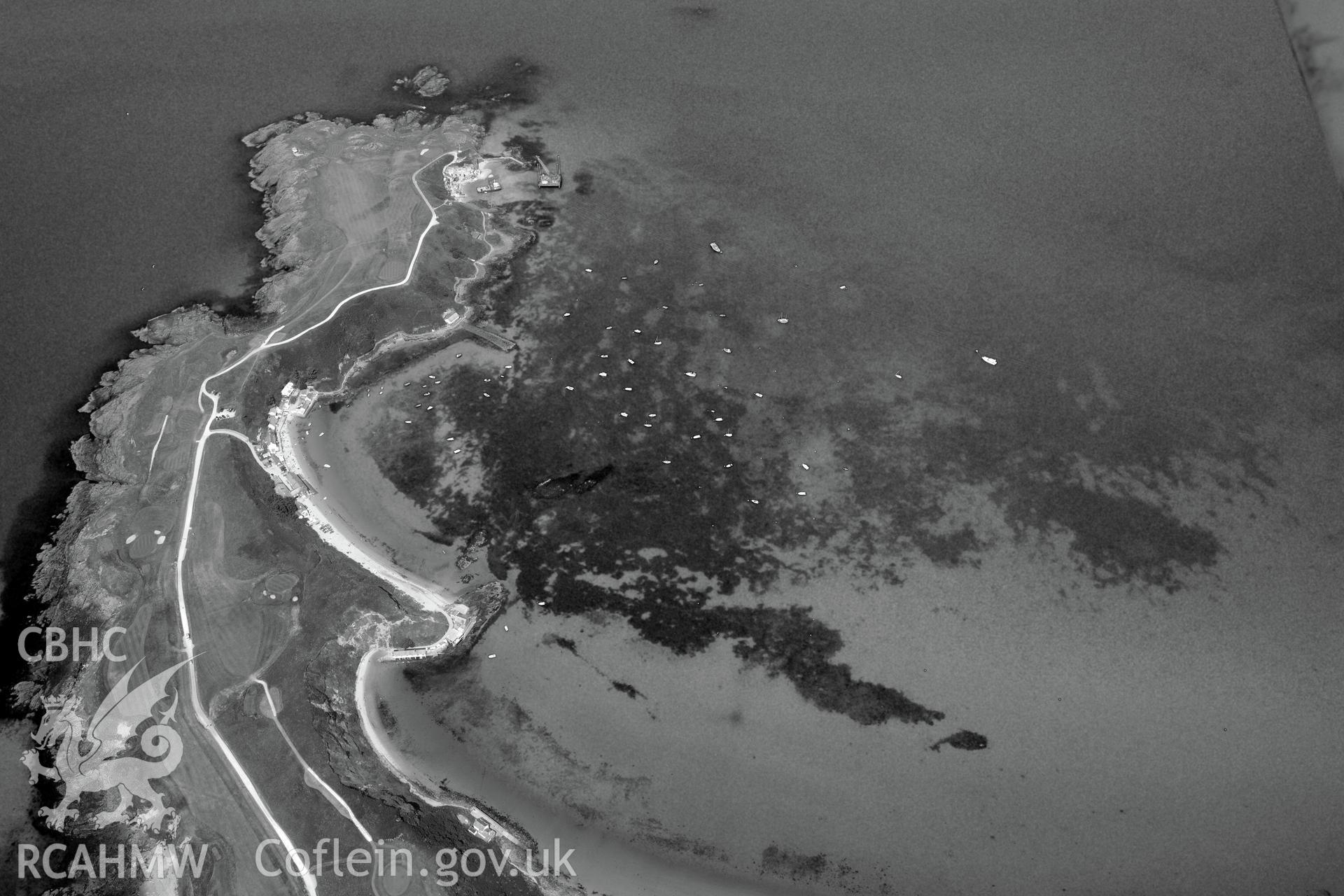 Lifeboat House, Lighthouse, Old Pier, Trwyn Porth Dinllaen Promontory Enclosure and Porth Dinllaen village. Oblique aerial photograph taken during the Royal Commission?s programme of archaeological aerial reconnaissance by Toby Driver on 12th July 2013.