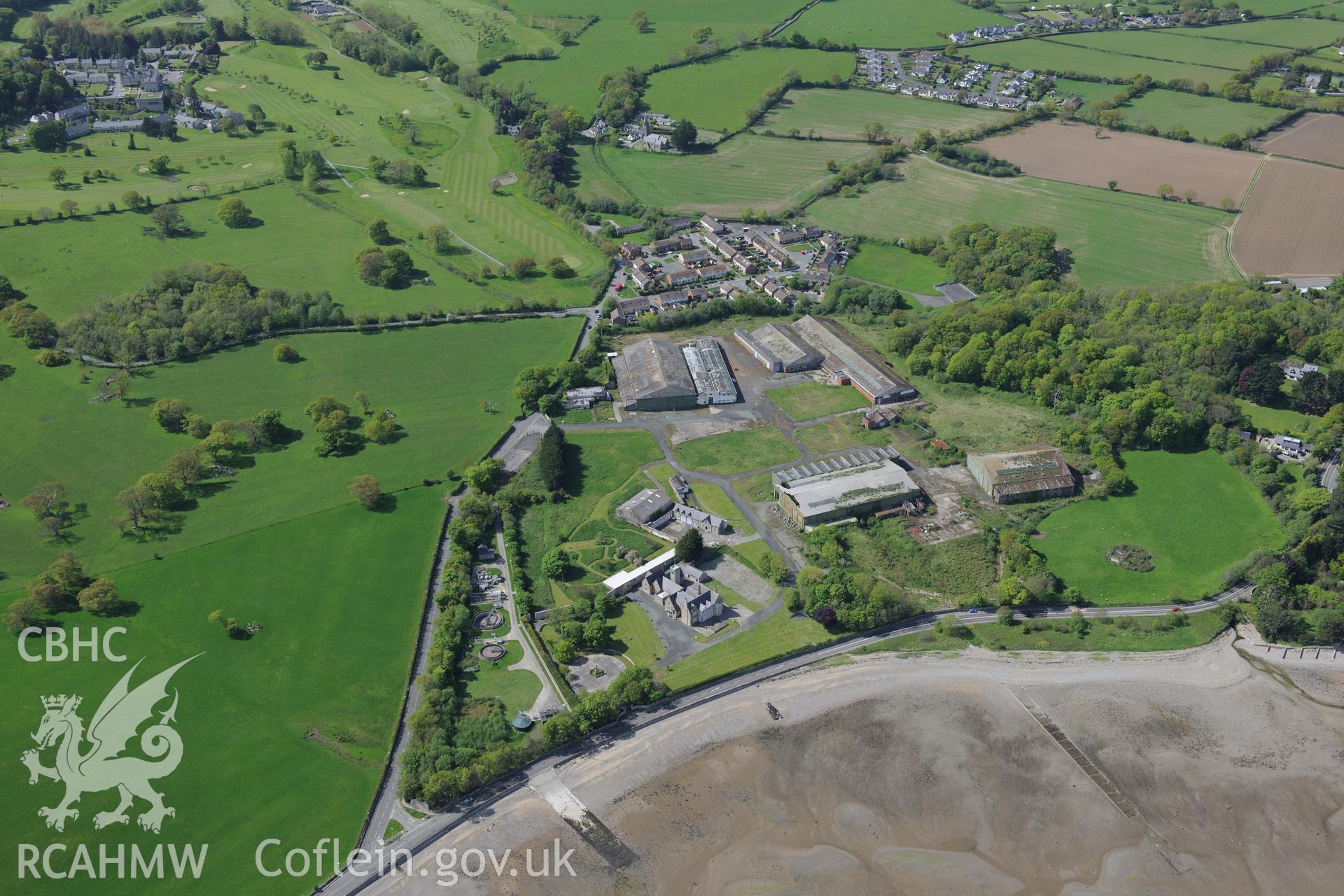 Llanfaes Friary and garden, and Beaumaris Flying Boat Station, Beaumaris. Oblique aerial photograph taken during the Royal Commission?s programme of archaeological aerial reconnaissance by Toby Driver on 22nd May 2013.