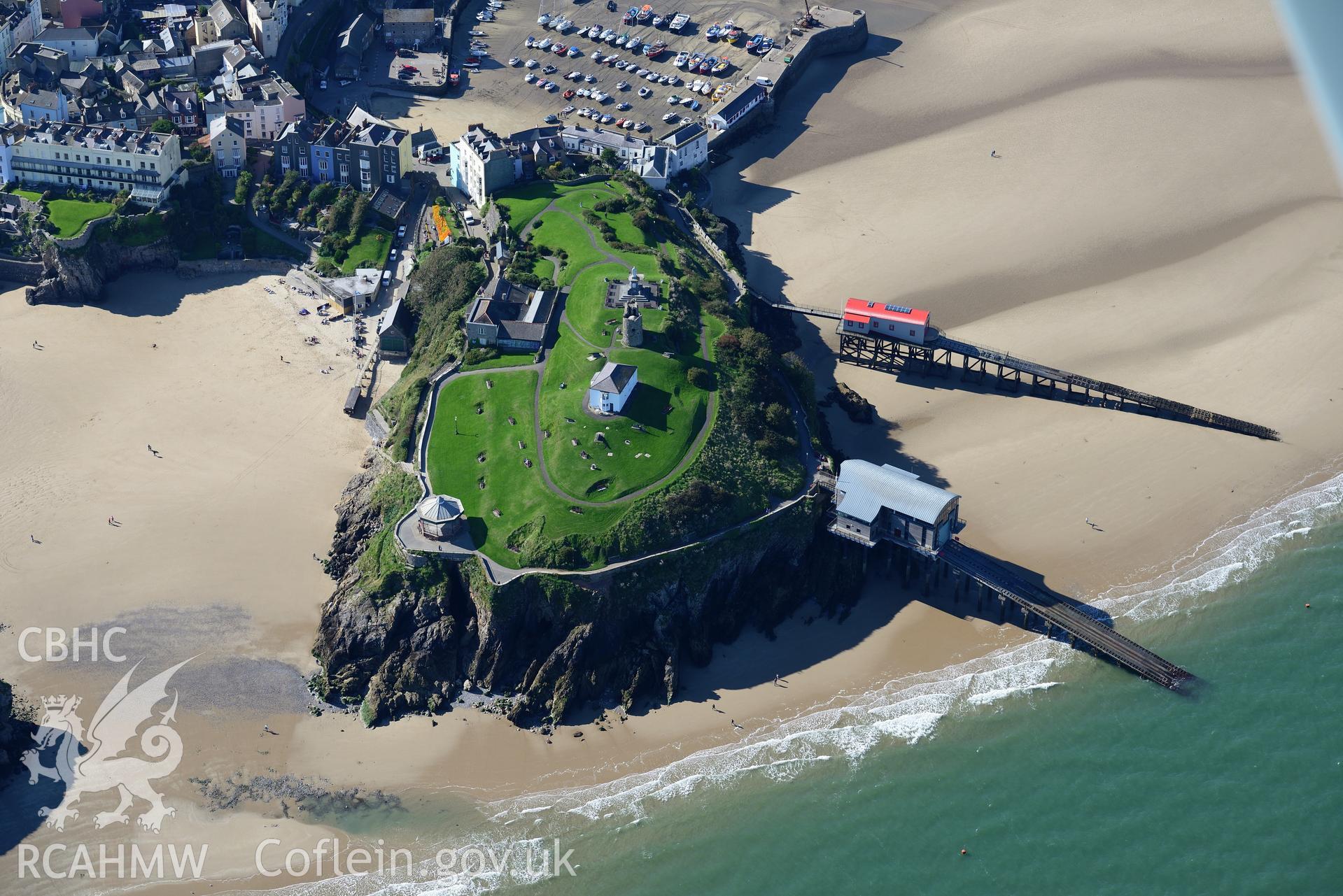 Tenby, its castle, public park, pier, coastguard house, old and new lifeboat station and lifeboat house. Oblique aerial photograph taken during the Royal Commission?s programme of archaeological aerial reconnaissance by Toby Driver on 30th September 2015.