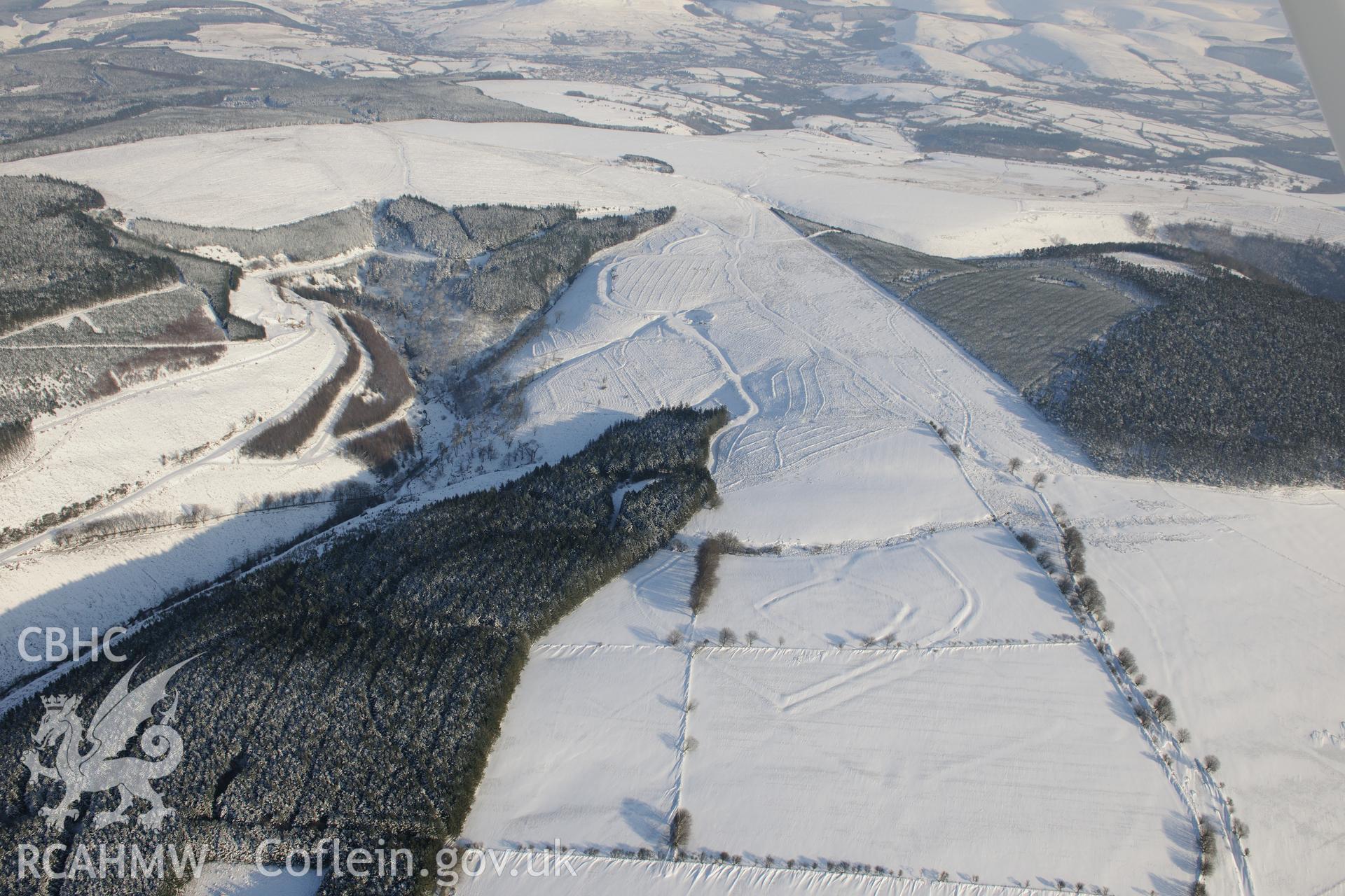 Moel Ton-Mawr hillfort and field system. Oblique aerial photograph taken during the Royal Commission?s programme of archaeological aerial reconnaissance by Toby Driver on 24th January 2013.