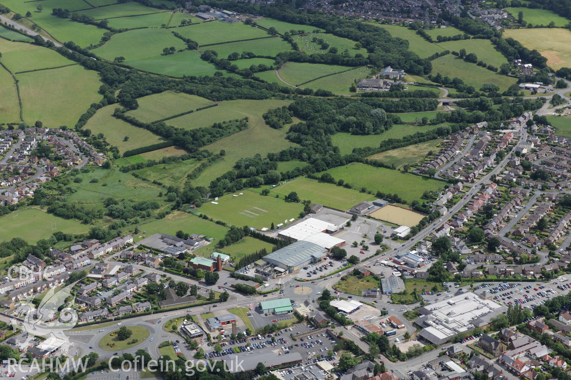 Mold gold cape findspot, Congregational Church, Methodist Chapel and Catholic Church. Oblique aerial photograph taken during the Royal Commission's programme of archaeological aerial reconnaissance by Toby Driver on 30th July 2015.