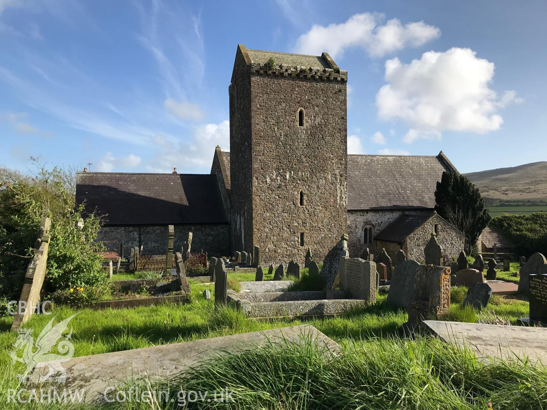 Colour photo showing external view of St. Cenydd's Church and graveyard, Llangenydd, taken by Paul R. Davis, 10th May 2018.