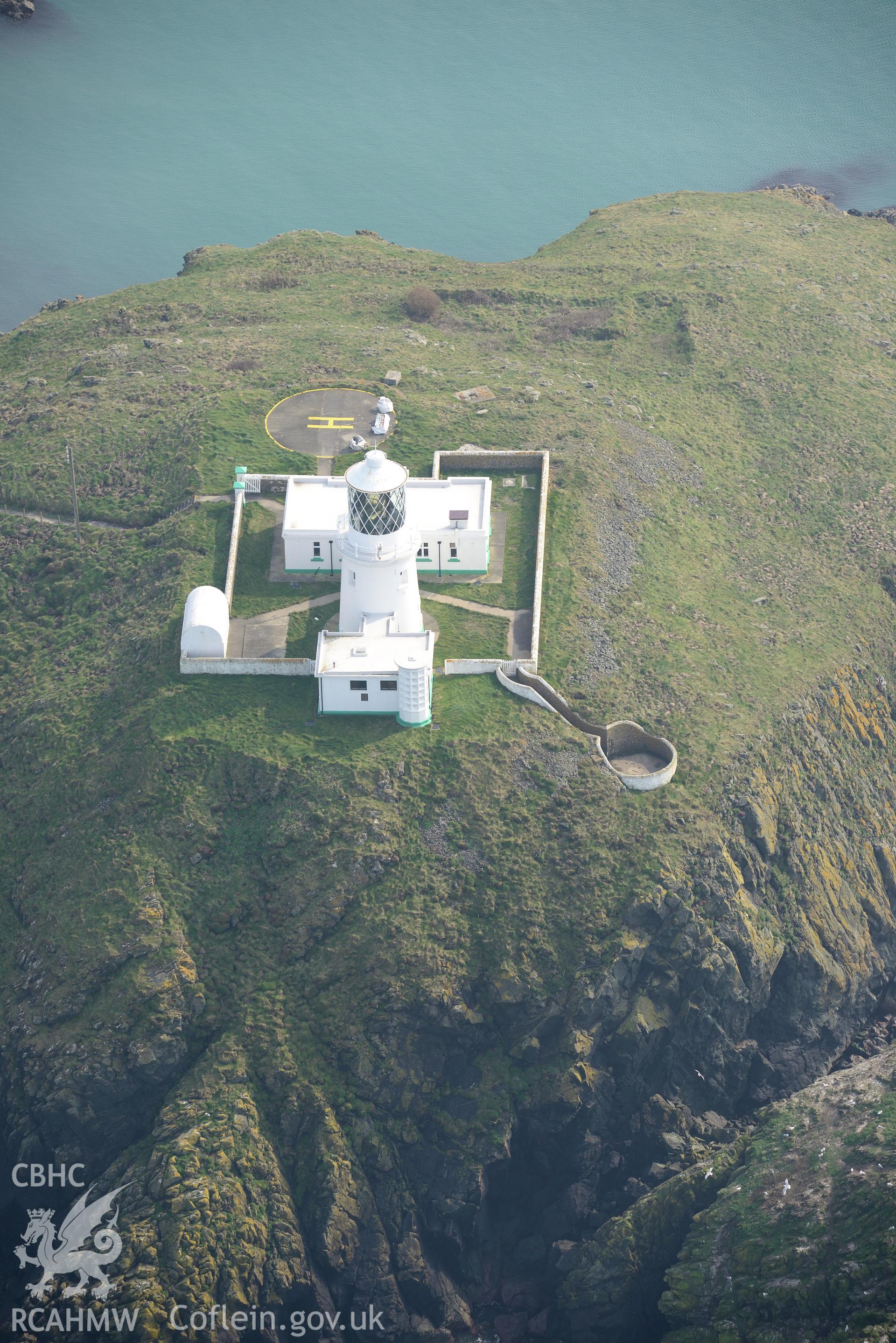 Aerial photography of Strumble Head lighthouse taken on 27th March 2017. Baseline aerial reconnaissance survey for the CHERISH Project. ? Crown: CHERISH PROJECT 2017. Produced with EU funds through the Ireland Wales Co-operation Programme 2014-2020. All material made freely available through the Open Government Licence.