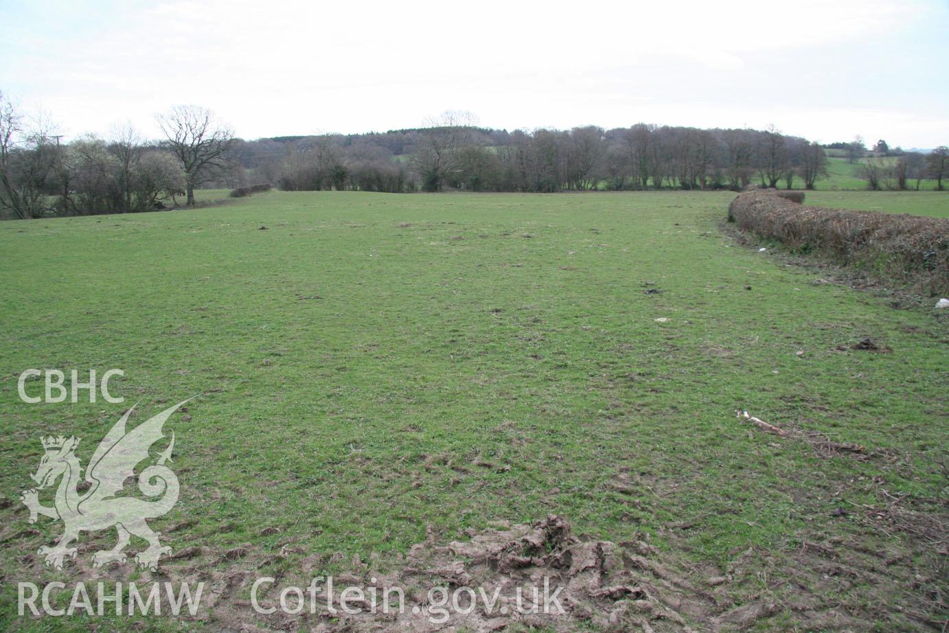 'Field's western & southern boundary (looking south-southeast)' Digital colour photograph taken during site visit to land south of school lane, Penperlleni. Part of Archaeological Desk Based Assessment conducted by Iestyn Jones of Archaeology Wales, 2014.