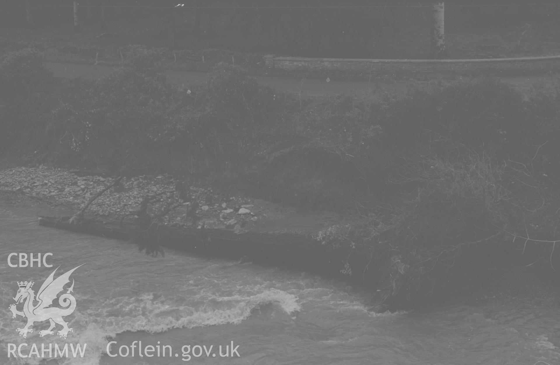 Digital copy of a black and white negative showing debris from the flood of the river Ystwyth at Trawscoed. Photographed by Arthur O. Chater in December 1964.