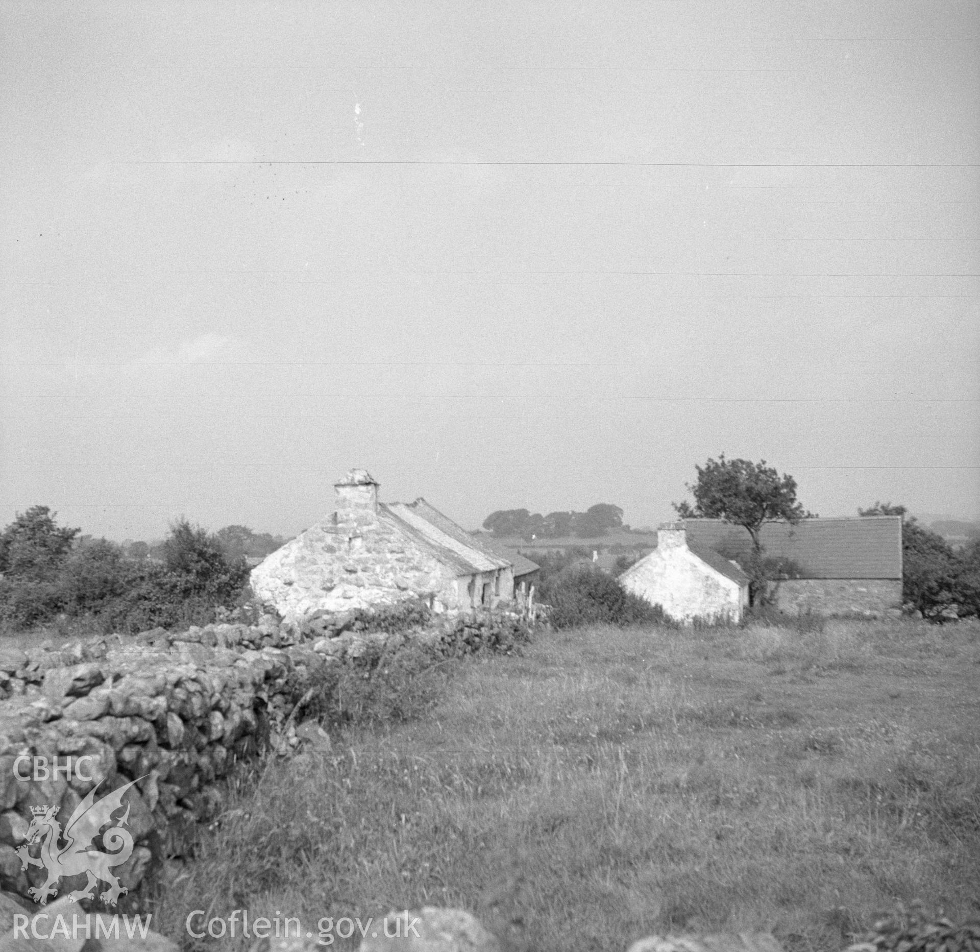 Digital copy of a nitrate negative showing exterior view of cottage to be relocated at the Folk Museum.