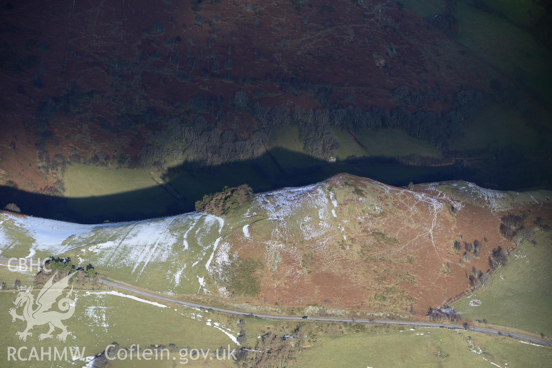 Pen-y-Clun hillfort, north west of Llanidloes. Oblique aerial photograph taken during the Royal Commission's programme of archaeological aerial reconnaissance by Toby Driver on 4th February 2015.