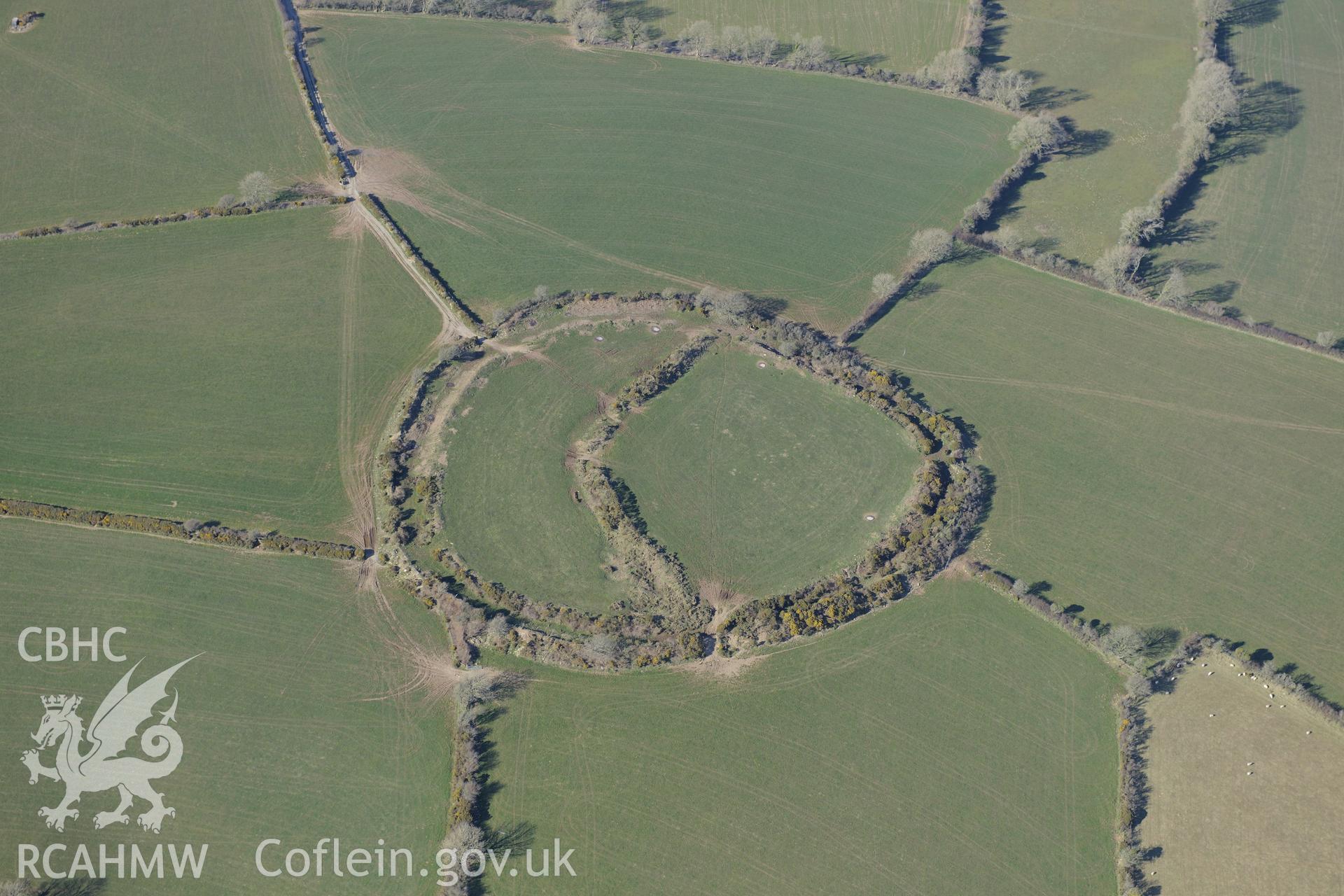 Castell Mawr henge or hillfort, Eglwyswrw, south west of Cardigan. Oblique aerial photograph taken during the Royal Commission's programme of archaeological aerial reconnaissance by Toby Driver on 2nd April 2013.