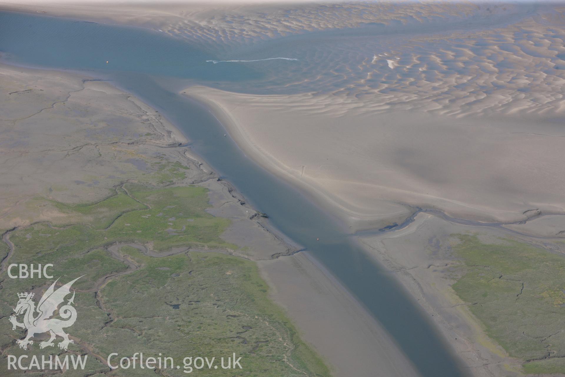 Unnamed Wreck at the mouth of the Leri and Unnamed Wreck in the Dyfi estuary north of Ynyslas, Aberystwyth. Oblique aerial photograph taken during the Royal Commission?s programme of archaeological aerial reconnaissance by Toby Driver on 12th July 2013.