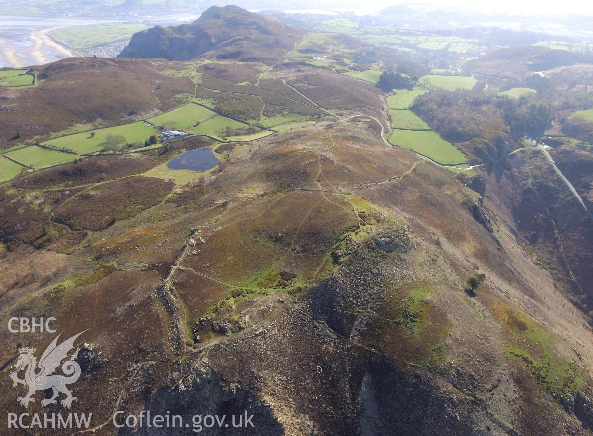 Colour photo showing aerial view of Dinas Allt Wen, a hillfort above Dwygyfylchi, Penmaenmawr, taken by Paul R. Davis, 19th April 2018.