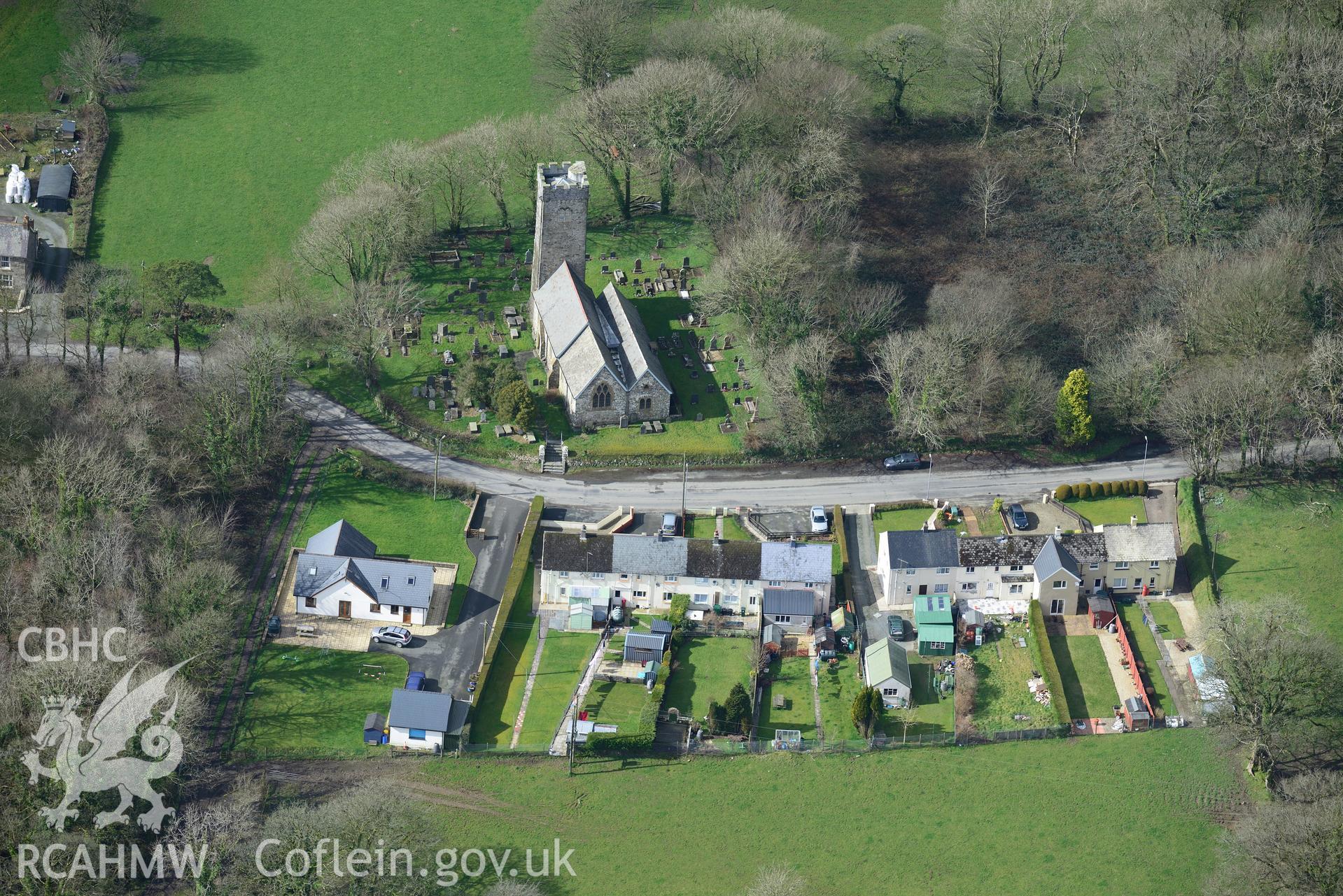 St. Nicholas's Church in the village of New Moat. Oblique aerial photograph taken during the Royal Commission's programme of archaeological aerial reconnaissance by Toby Driver on 13th March 2015.