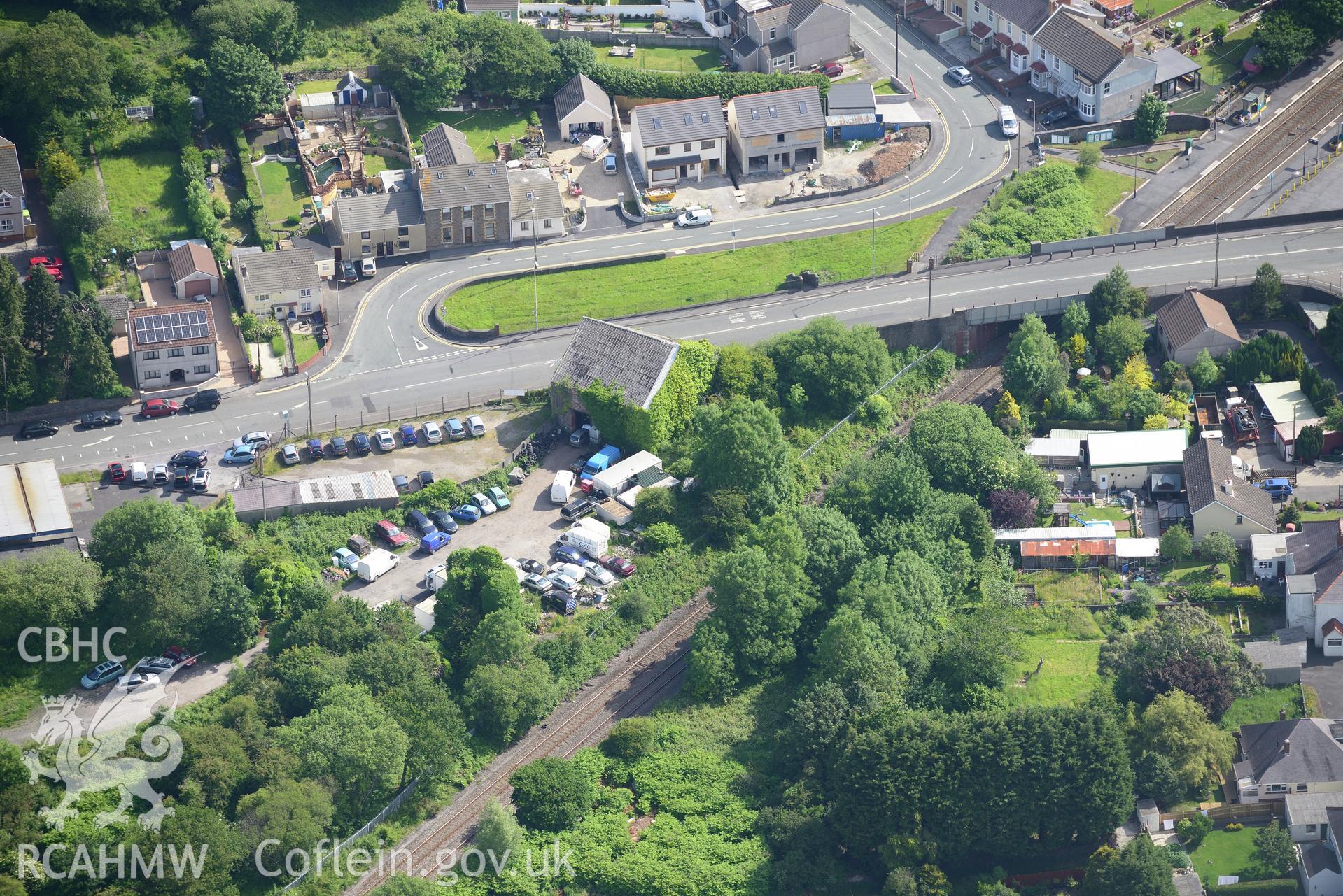 Glynea Pit engine house and the village of Bynea, Llanelli. Oblique aerial photograph taken during the Royal Commission's programme of archaeological aerial reconnaissance by Toby Driver on 19th June 2015.