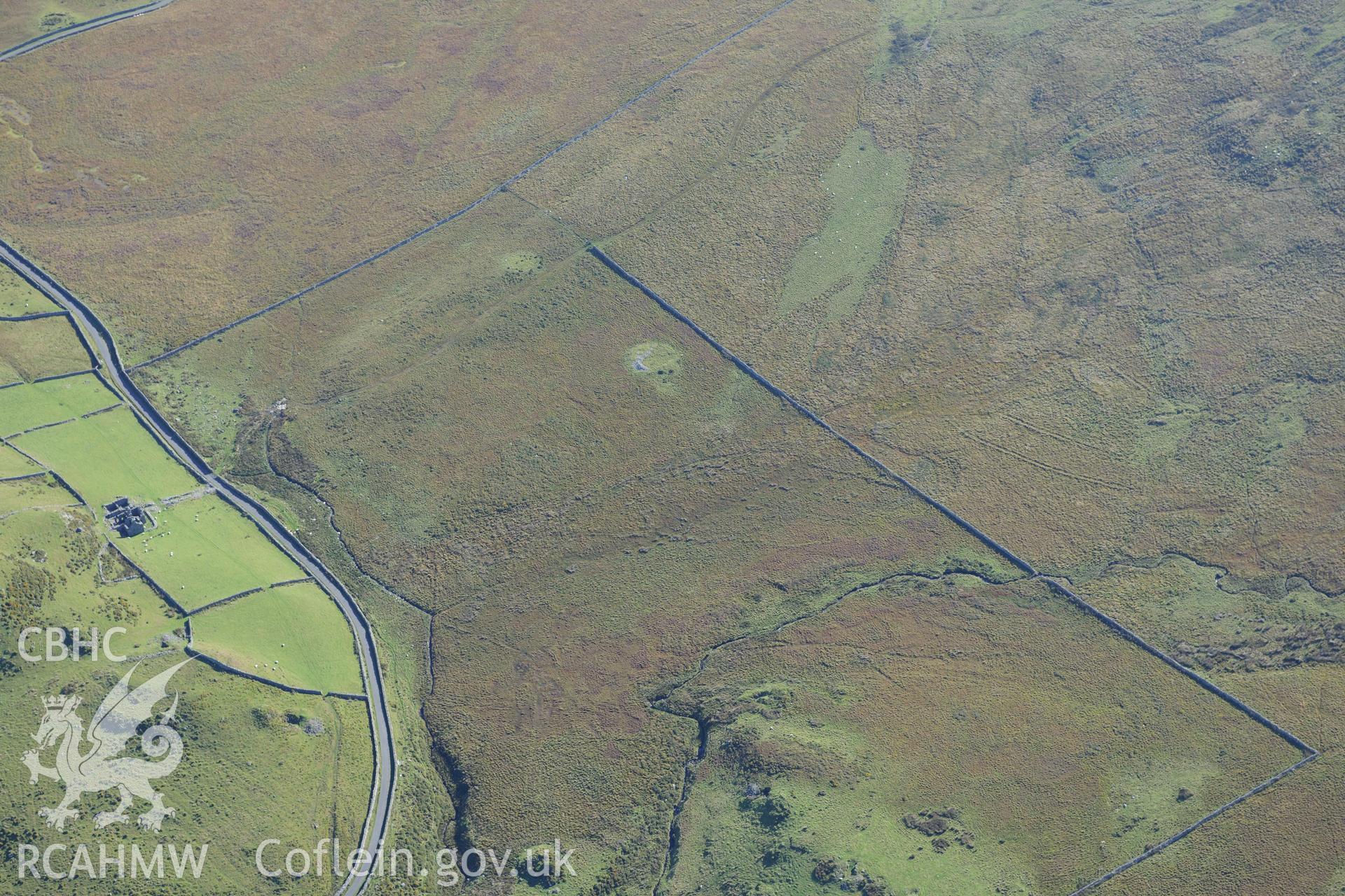 Hafotty Fach house, clearance & cultivation northwest of the house & cairn south east of the house, near Fairbourne. Oblique aerial photograph taken during the Royal Commission?s programme of archaeological aerial reconnaissance by Toby Driver, 2/10/2015.