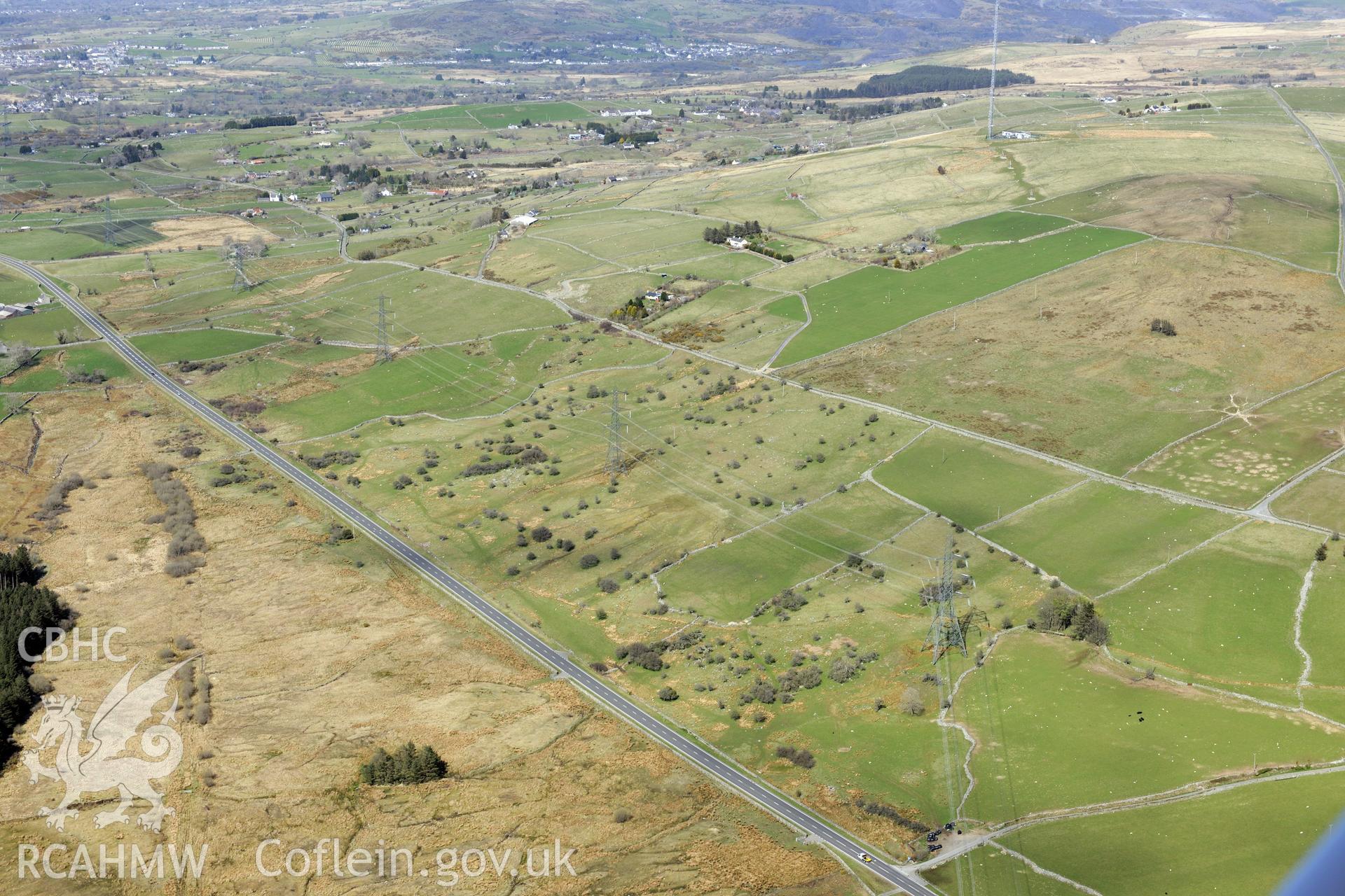 Caerau settlements I, II, and III, Llanllyfni, north west of Porthmadog. Oblique aerial photograph taken during the Royal Commission?s programme of archaeological aerial reconnaissance by Toby Driver on 1st May 2013.