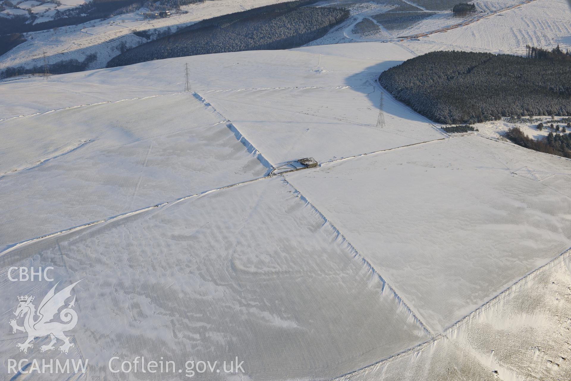Mynydd Brombil enclosure earthwork, on the eastern edge of Margam Forest, Margam, Port Talbot. Oblique aerial photograph taken during the Royal Commission?s programme of archaeological aerial reconnaissance by Toby Driver on 24th January 2013.