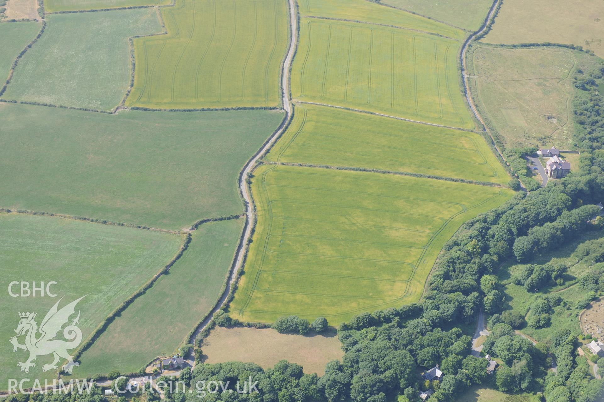 Pont y Penyd Cropmarks and the Vicarage at Penrhiw, St Davids. Oblique aerial photograph taken during the Royal Commission?s programme of archaeological aerial reconnaissance by Toby Driver on 16th July 2013.