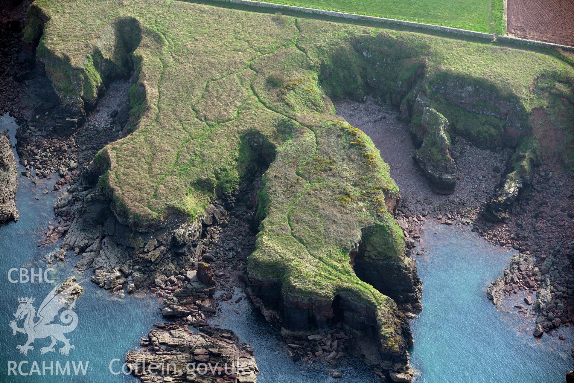 Aerial photography of Castle Head promontory fort taken on 27th March 2017. Baseline aerial reconnaissance survey for the CHERISH Project. ? Crown: CHERISH PROJECT 2017. Produced with EU funds through the Ireland Wales Co-operation Programme 2014-2020. All material made freely available through the Open Government Licence.