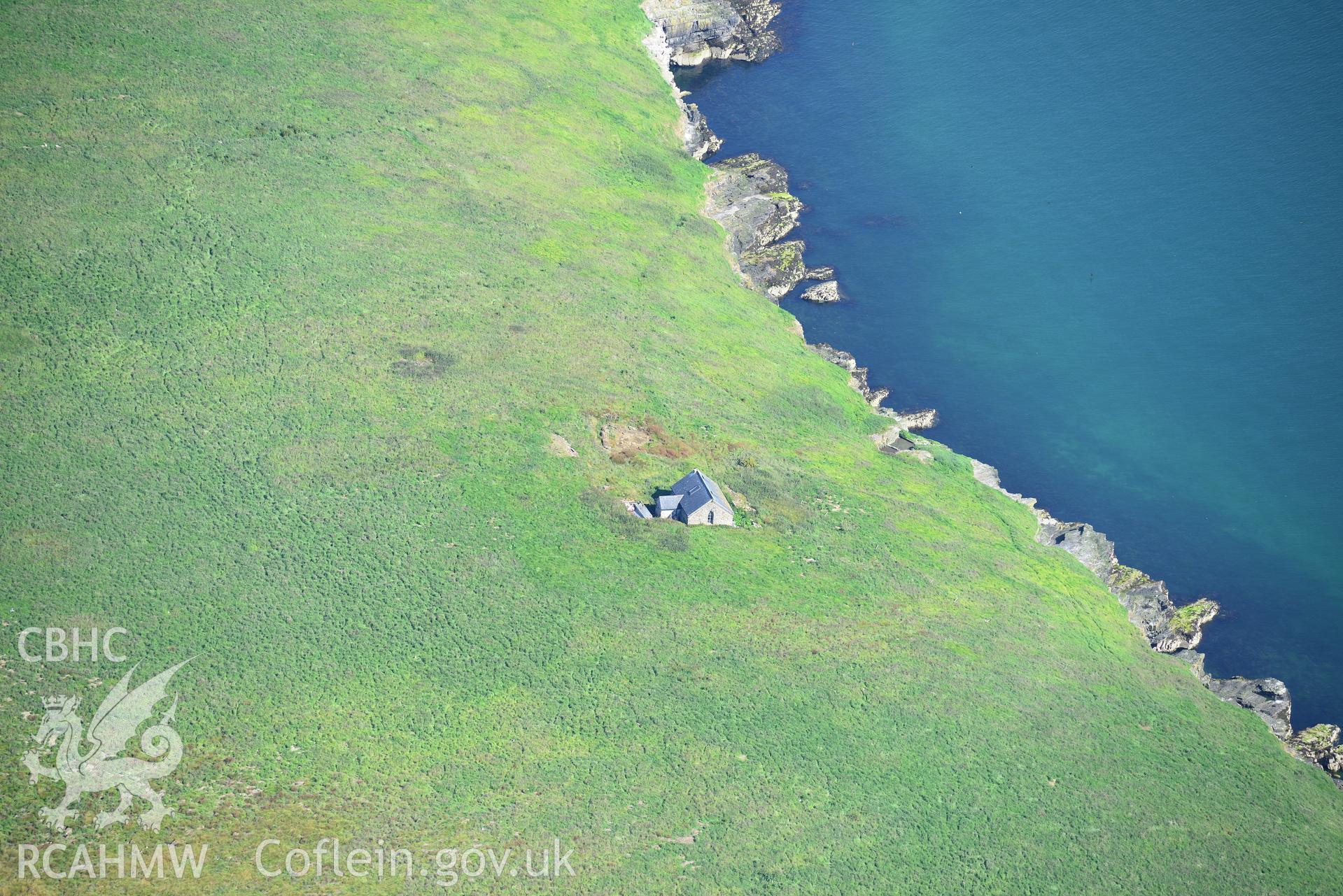 The chapel building and the footings of a priory hall at St. Tudwal's Island East. Oblique aerial photograph taken during the Royal Commission's programme of archaeological aerial reconnaissance by Toby Driver on 23rd June 2015.