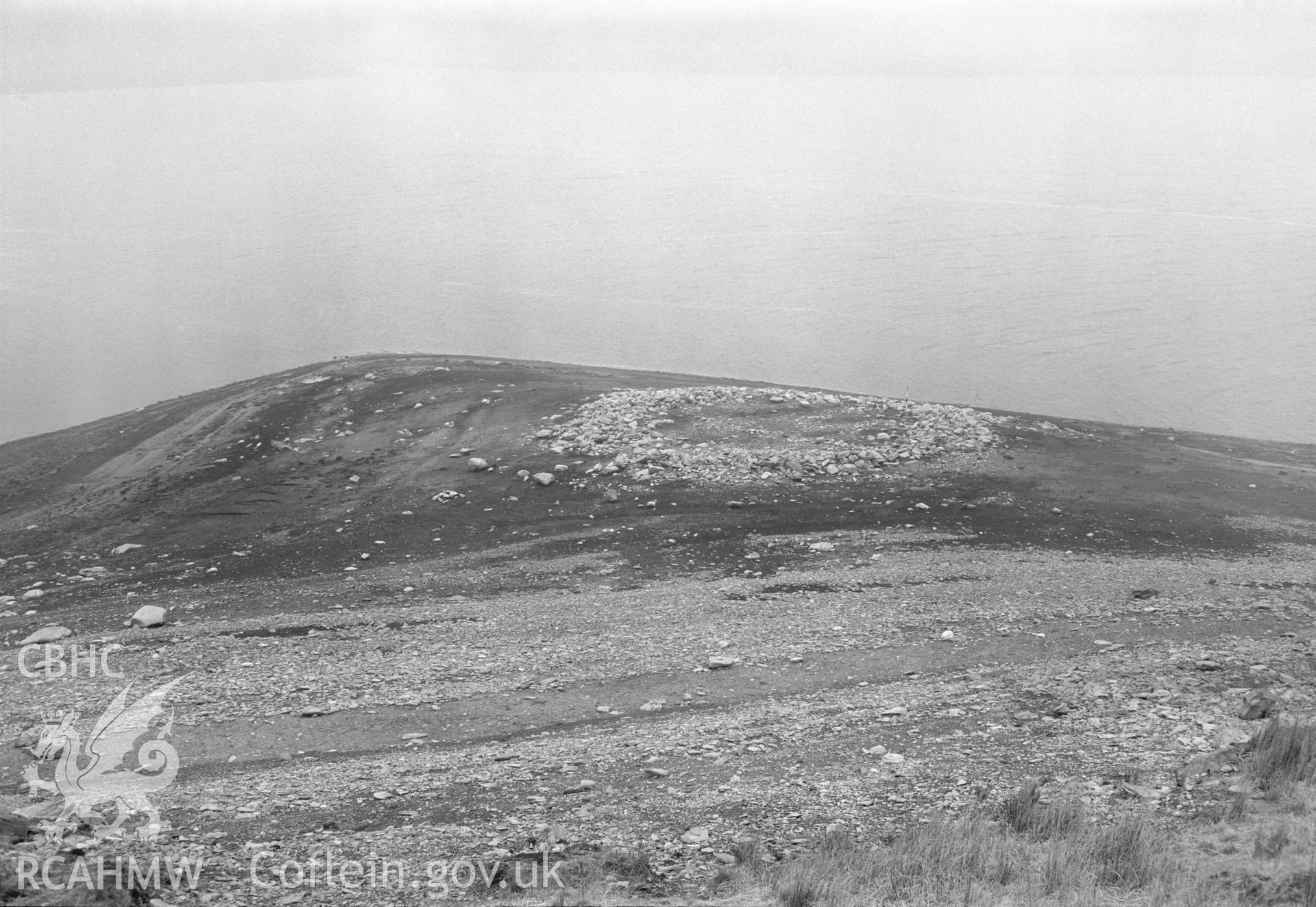 Digital copy of a black and white nitrate negative showing a view of Aber Camddwr cairn, taken by RCAHMW, undated.