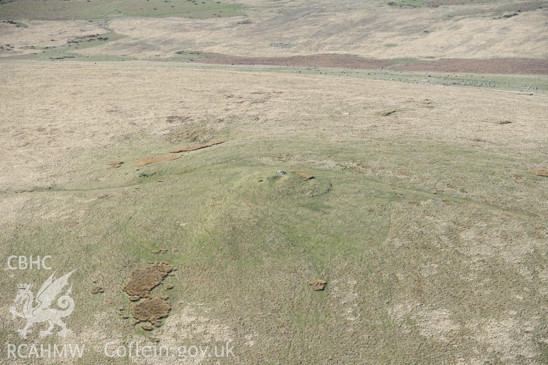 Foel Feddau, Cairn. Oblique aerial photograph taken during the Royal Commission's programme of archaeological aerial reconnaissance by Toby Driver on 15th April 2015.