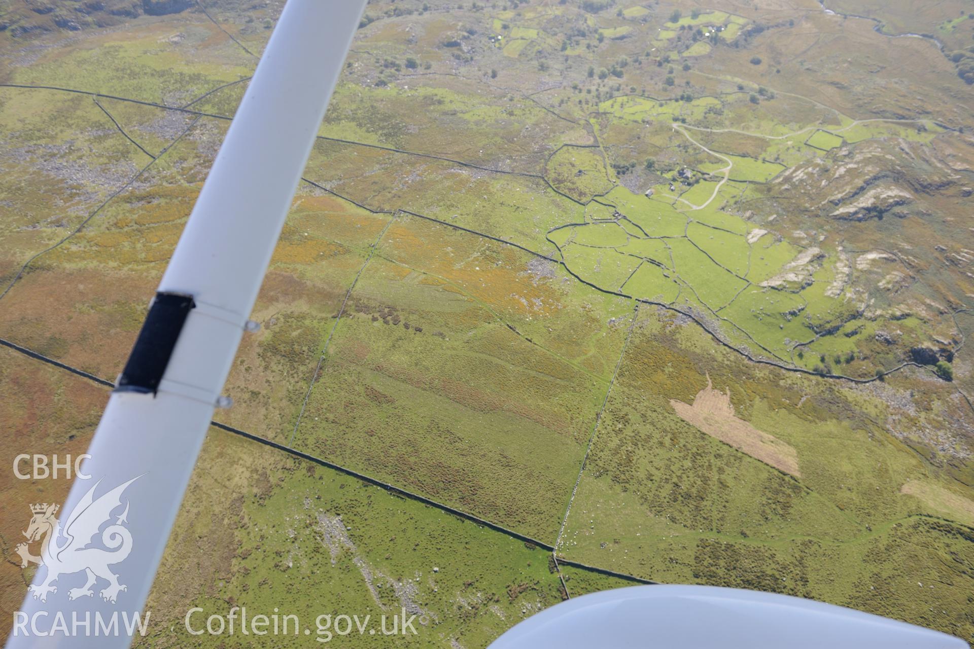 Caergynog farm, Crafnant copper mine and Crafnant manganese mine, north east of Llanbedr. Oblique aerial photograph taken during the Royal Commission's programme of archaeological aerial reconnaissance by Toby Driver on 2nd October 2015.