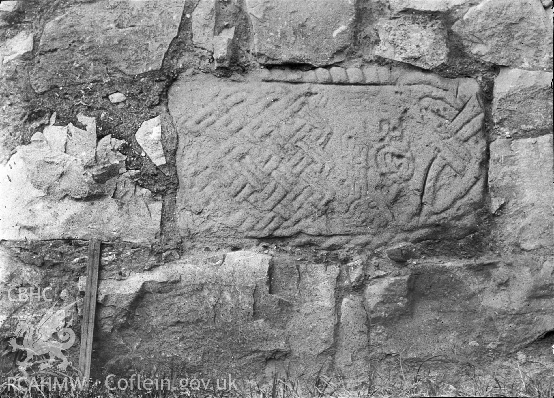 Digital copy of a nitrate negative showing view of inscribed stones in vicarage wall at the  Friary near Rhuddlan Church,  taken by Leonard Monroe.