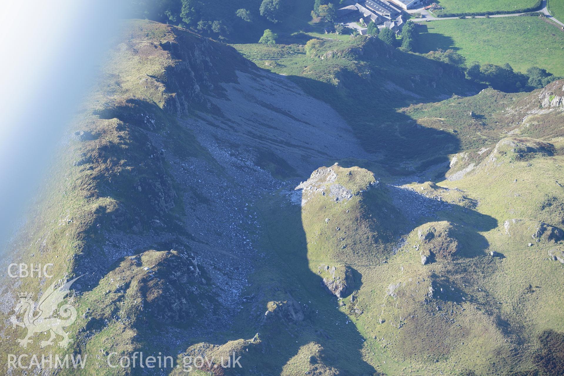 Craig yr Aderyn cairn, and a crag to its east, near Abergynolwyn. Oblique aerial photograph taken during the Royal Commission's programme of archaeological aerial reconnaissance by Toby Driver on 2nd October 2015.