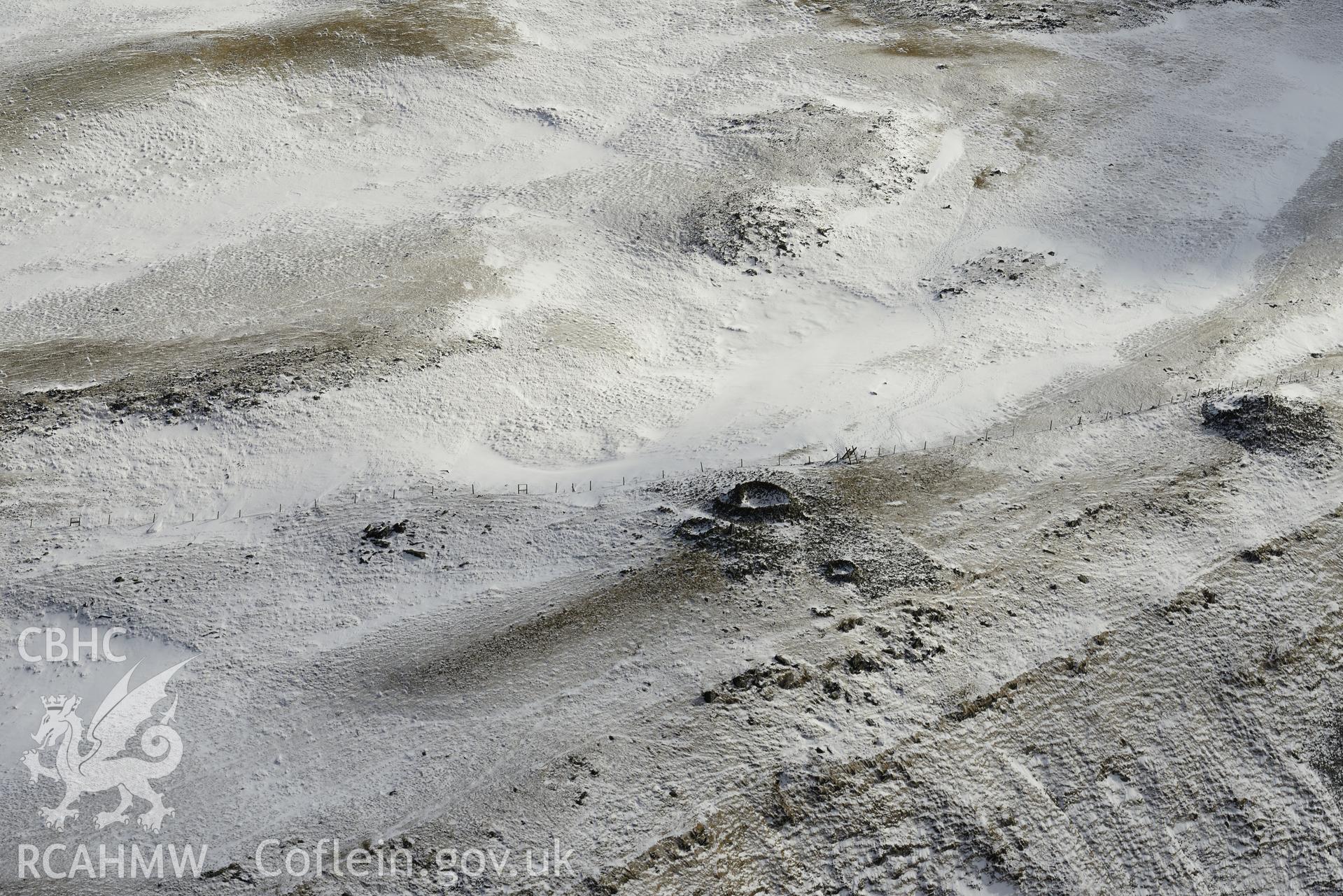 The central cairn and the south cairn on Pen Plynlimon Fawr, between Aberystwyth and Llangurig. Oblique aerial photograph taken during the Royal Commission's programme of archaeological aerial reconnaissance by Toby Driver on 4th February 2015.