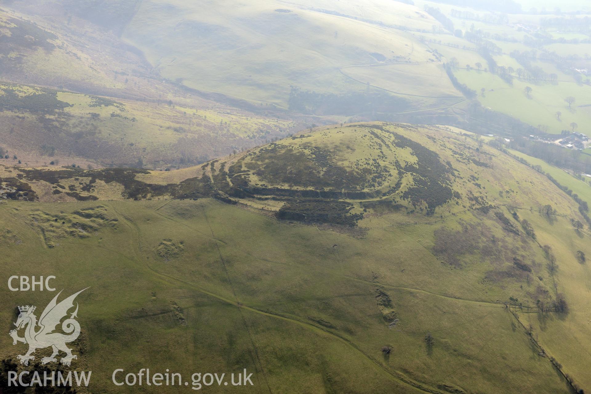 Moel-y-Gaer hillfort, Llanbedr, between Ruthin and Mold. Oblique aerial photograph taken during the Royal Commission?s programme of archaeological aerial reconnaissance by Toby Driver on 28th February 2013.