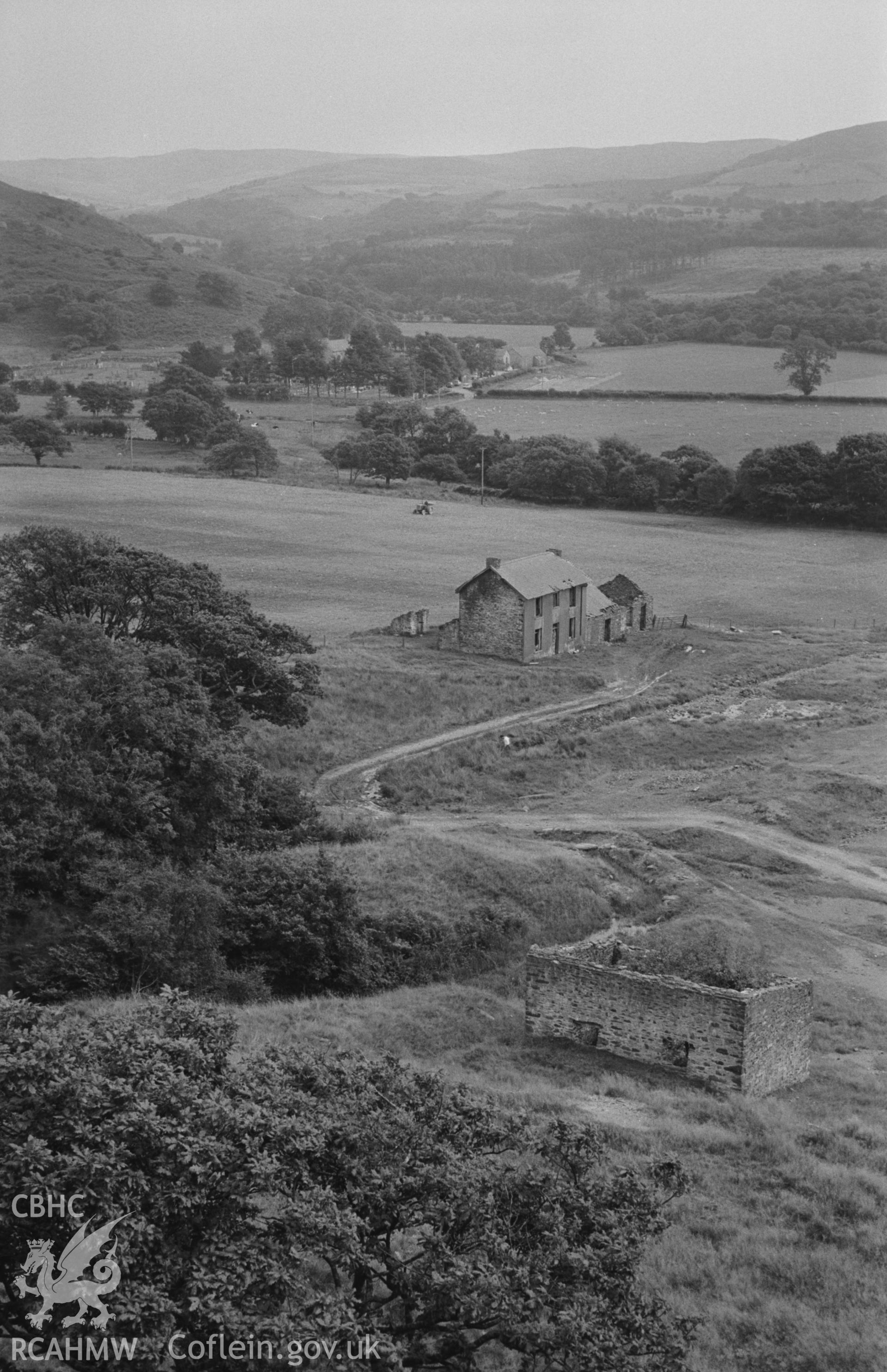 Digital copy of a black and white negative showing view looking over Abbey Consols mine to Strata Florida. Photographed by Arthur O. Chater on 25th August 1967, looking south south east from Grid Reference SN 743 662.