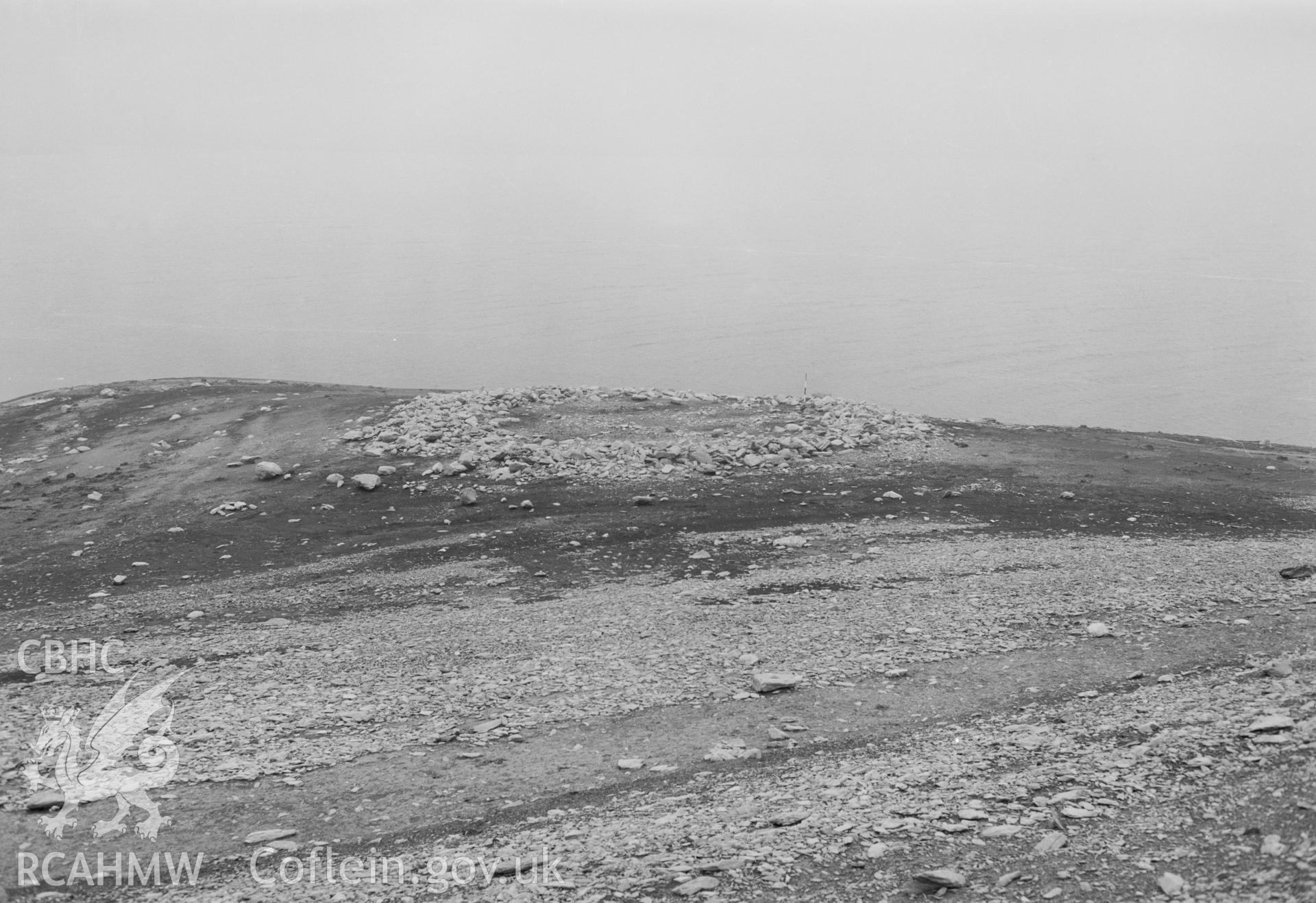 Digital copy of a black and white nitrate negative showing a view of Aber Camddwr cairn, taken by RCAHMW, undated.