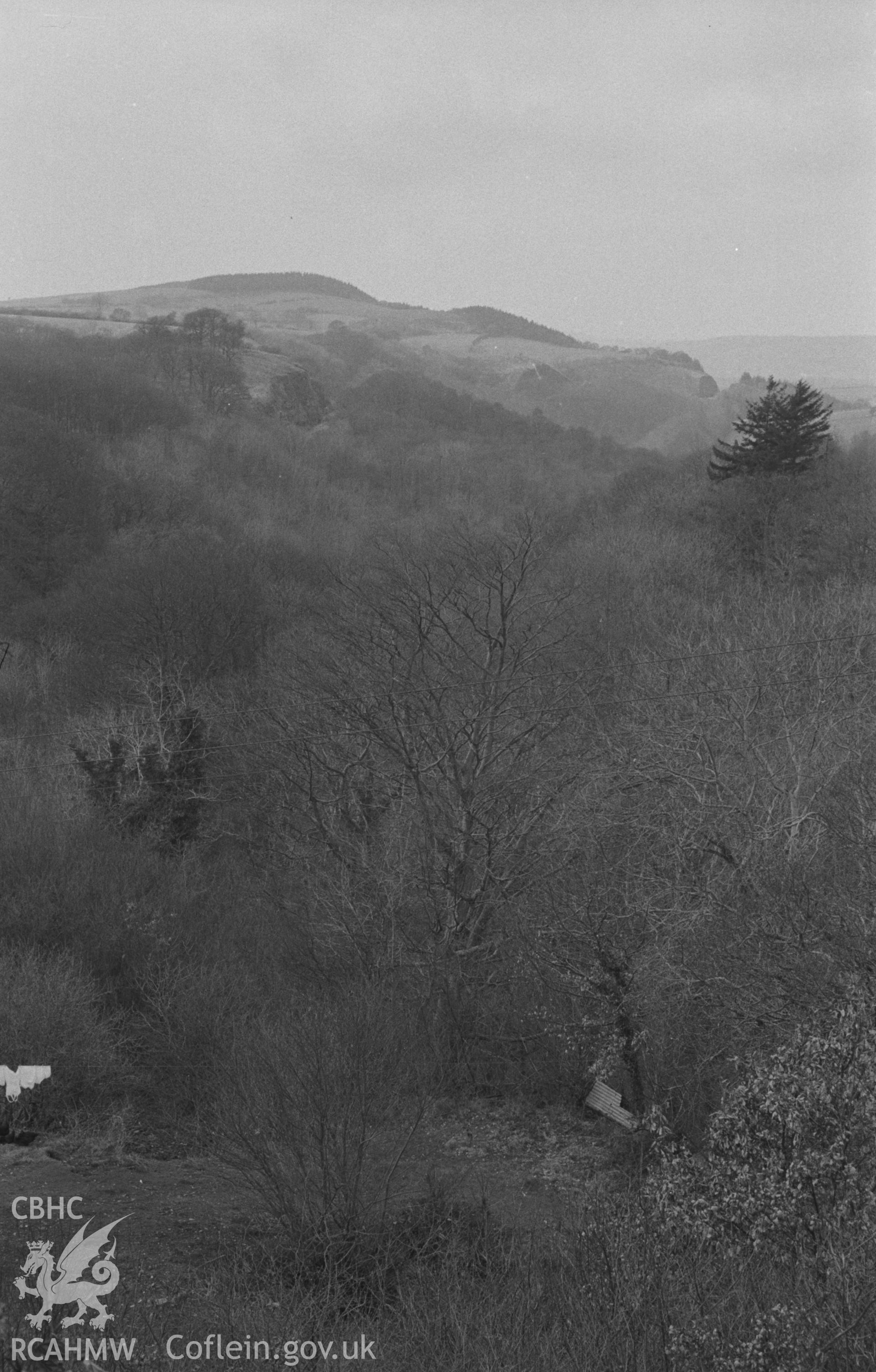 Digital copy of black & white negative showing Coed Berth-Lwyd looking down the Sychnant from the back of the Post Office near Caradog Falls Railway Halt. Photographed in April 1964 by Arthur O. Chater from Grid Reference SN 6926 6948, looking north west.