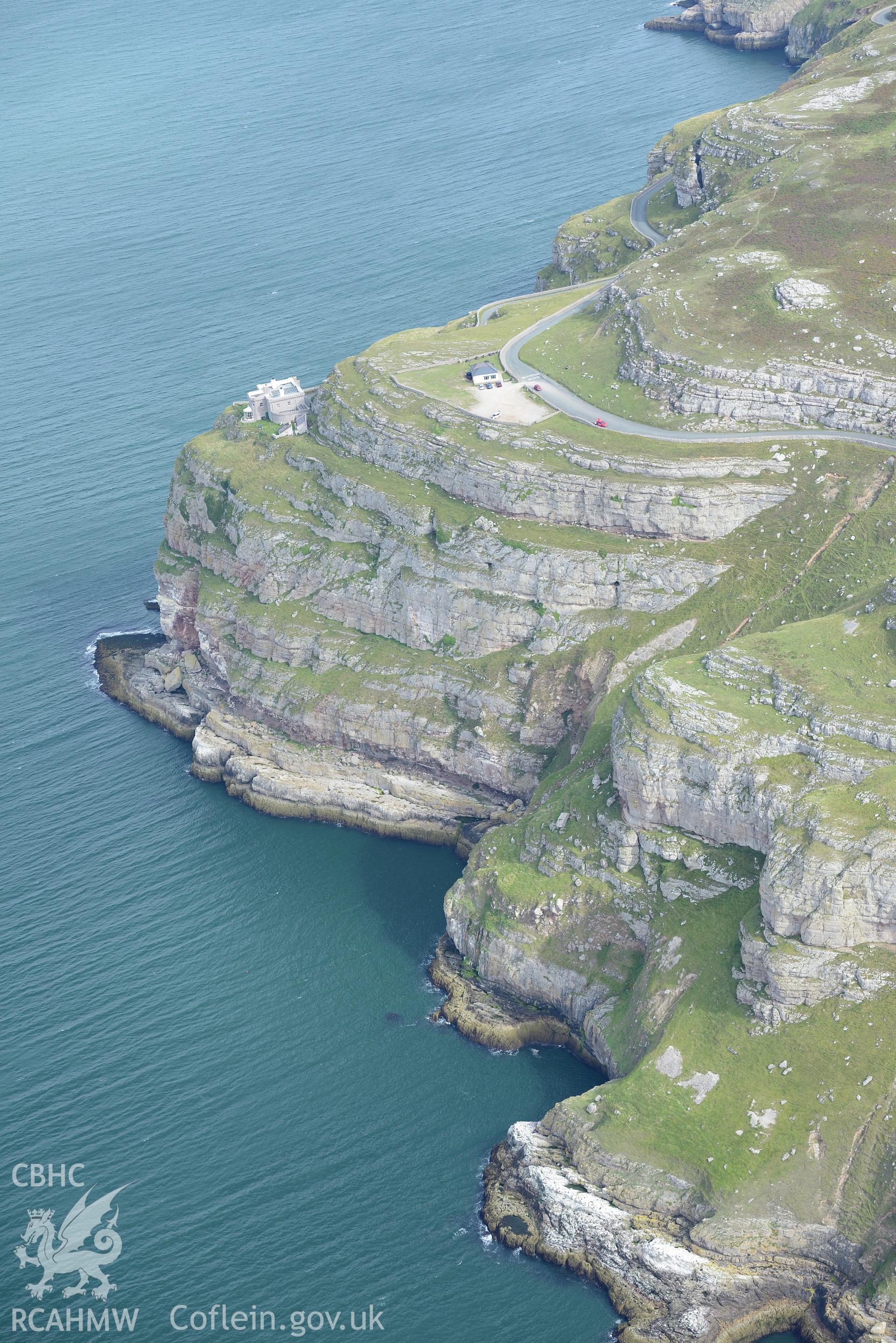 Great Orme's Head lighthouse. Oblique aerial photograph taken during the Royal Commission's programme of archaeological aerial reconnaissance by Toby Driver on 11th September 2015.