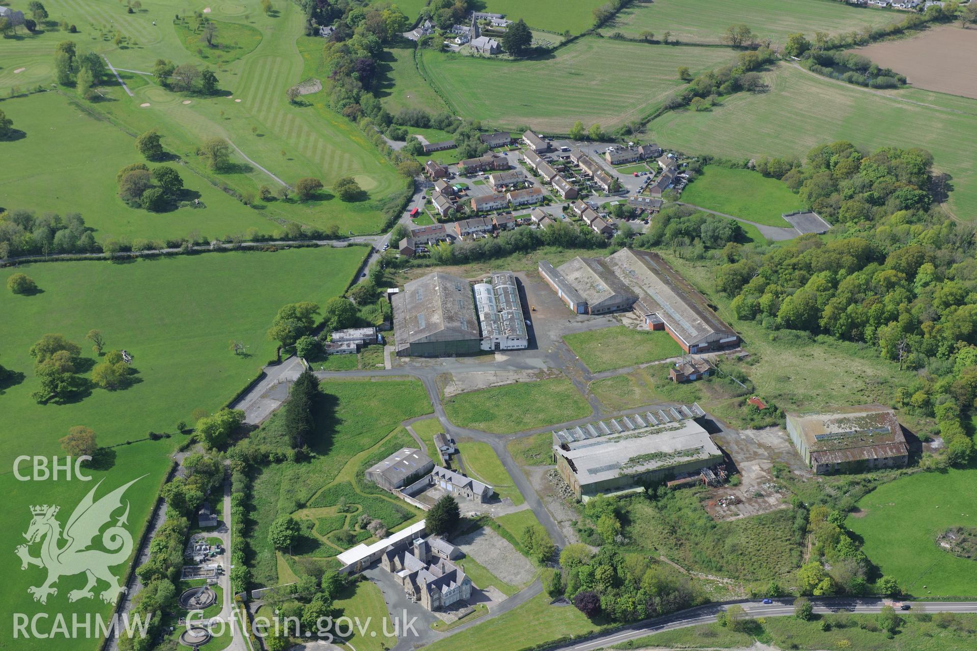 Llanfaes Friary and garden, and Beaumaris Flying Boat Station, Beaumaris. Oblique aerial photograph taken during the Royal Commission?s programme of archaeological aerial reconnaissance by Toby Driver on 22nd May 2013.