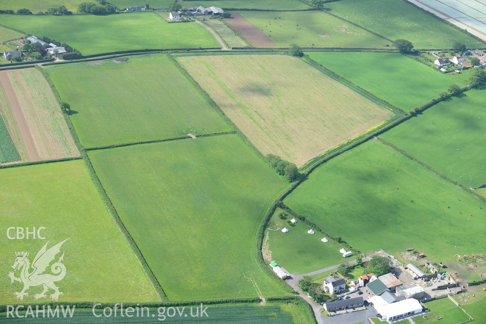 Windmill Farm and Mansel Jack standing stone. Oblique aerial photograph taken during the Royal Commission's programme of archaeological aerial reconnaissance by Toby Driver on 19th June 2015.