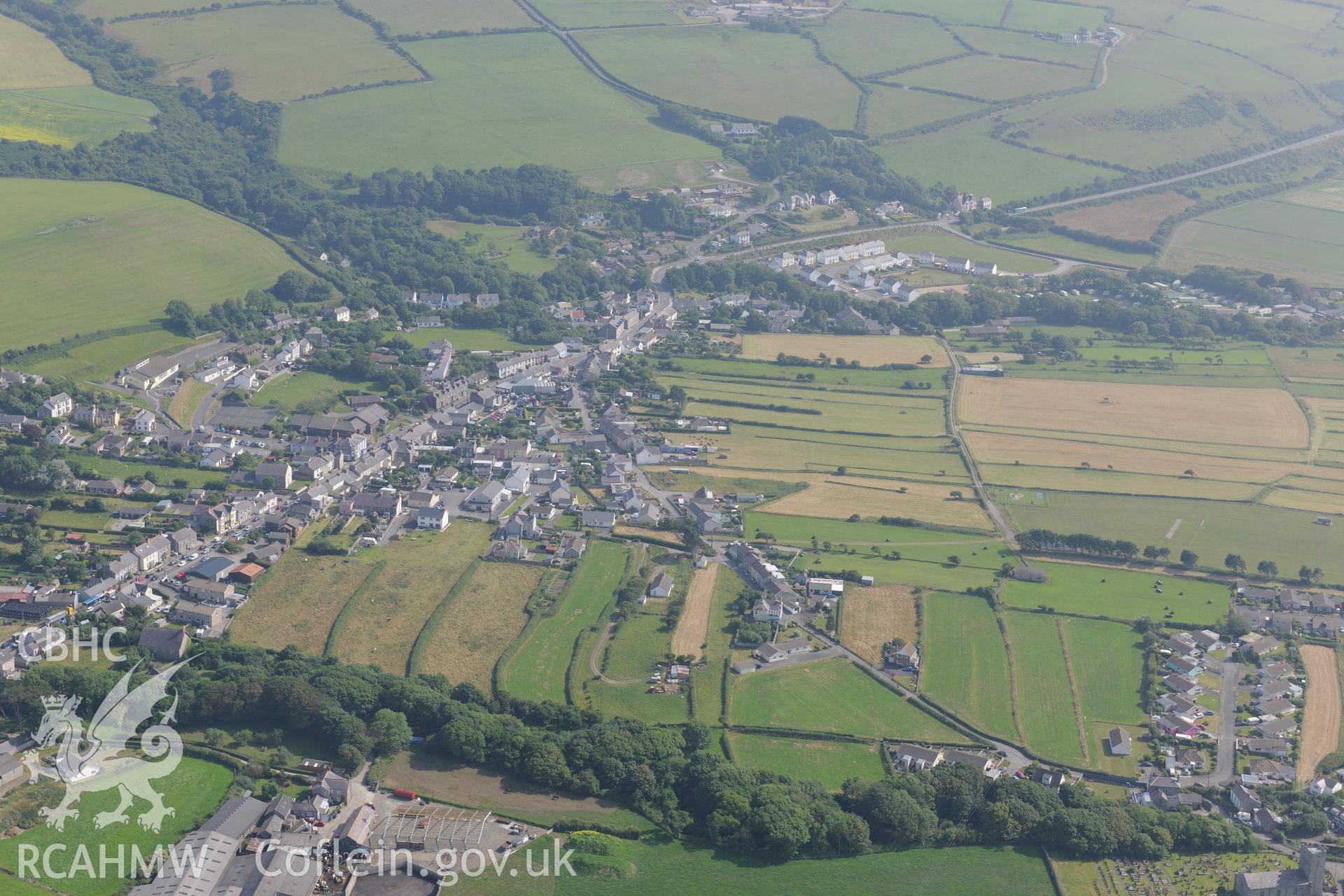 The village of Llanon, Ceredigion, including view of Llanon field system. Oblique aerial photograph taken during the Royal Commission?s programme of archaeological aerial reconnaissance by Toby Driver on 12th July 2013.